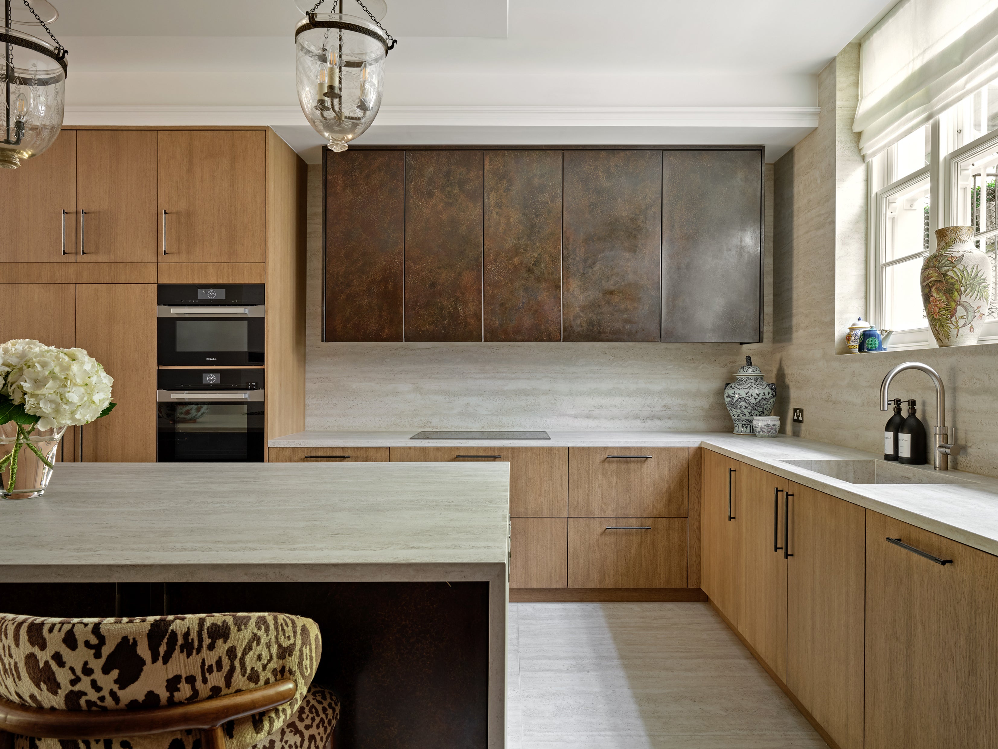Thoughtfully planned kitchen with generous circulation space between cabinetry and island, supporting smooth movement and everyday use (