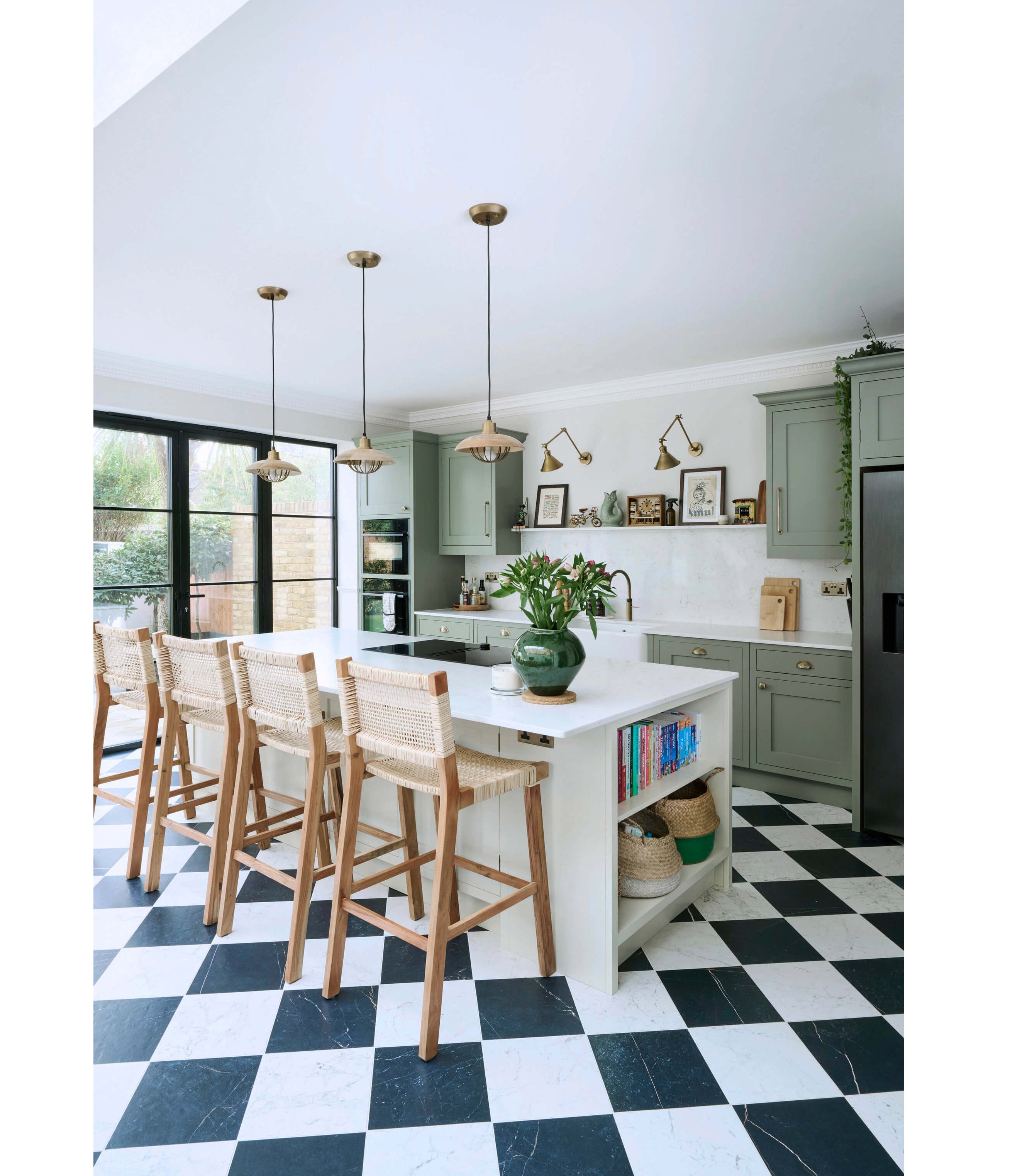 A bright, contemporary kitchen featuring a well-proportioned island that balances workspace, seating and circulation (Ray Munn Kitchens/Germaine Thurgood Photography/PA)