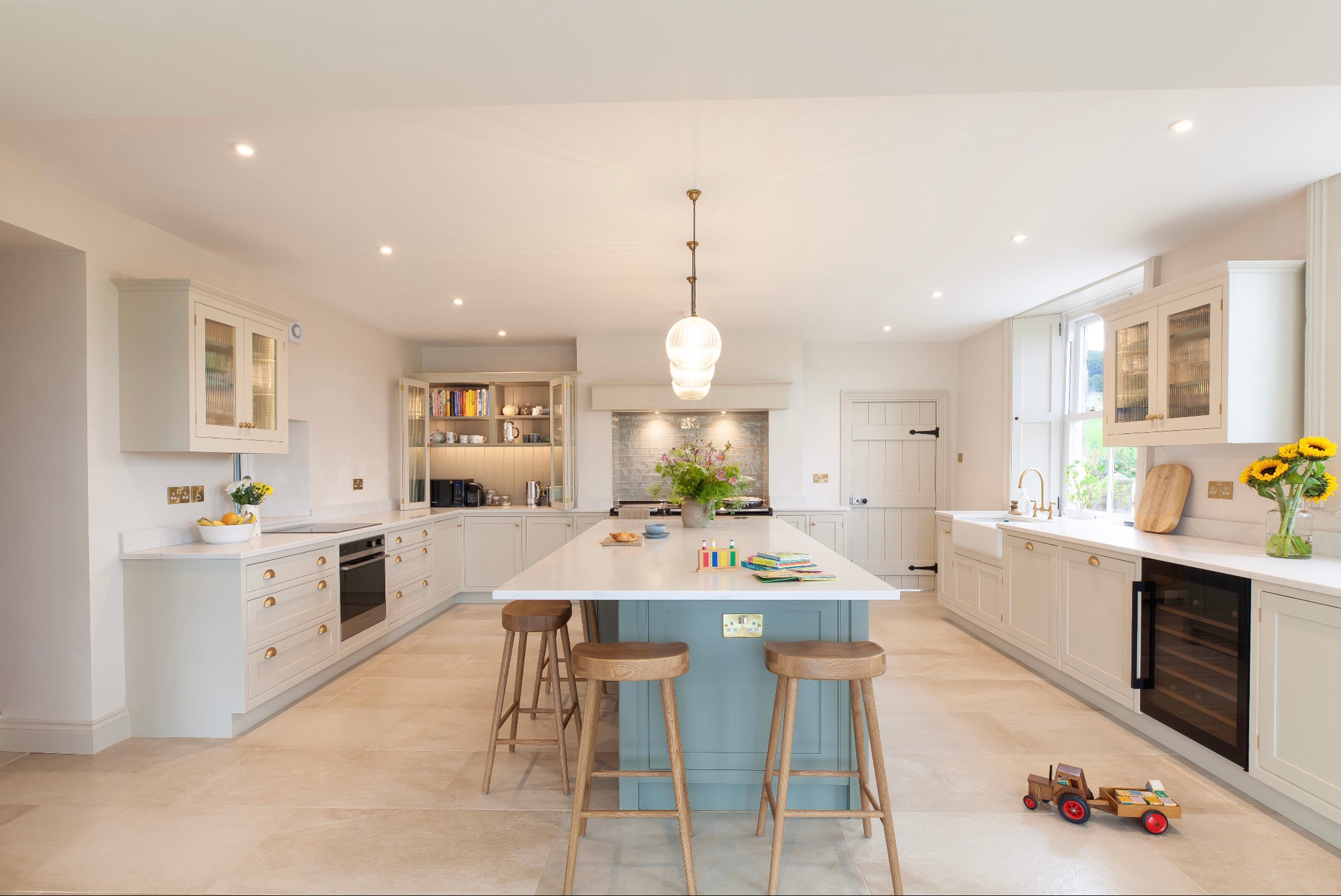 Shaker kitchen with integrated storage and considered lighting, helping to keep work areas practical and clutter out of sight