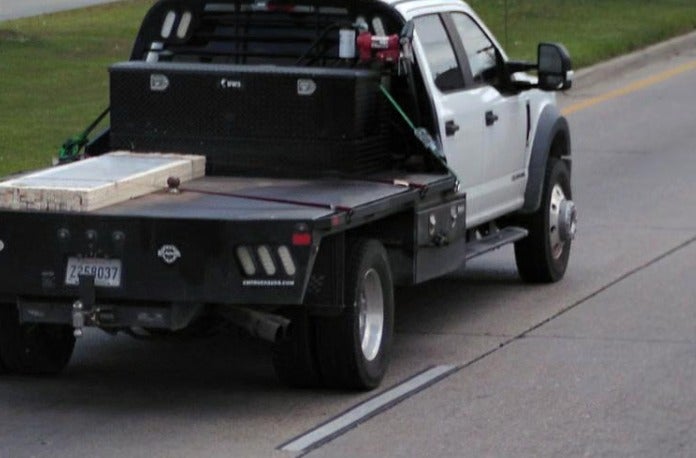 Investigators said they believed Collins stole a white 2019 Ford stake-bed truck (pictured) from a nearby business after the shooting and used it to drive about 150 miles away to Mobile, Alabama
