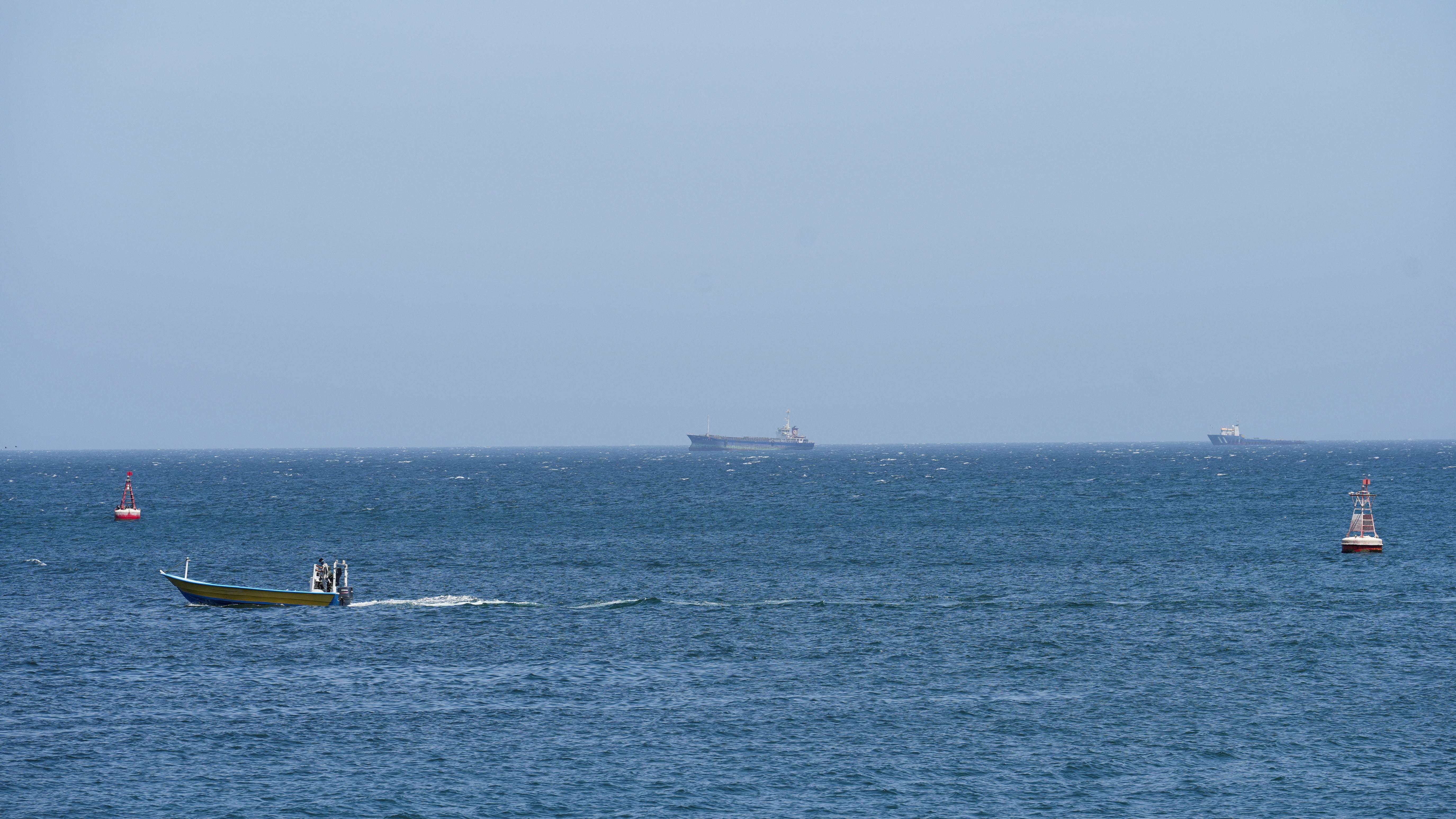 Vessels and boats pictured successful nan Strait of Hormuz disconnected nan seashore of Oman