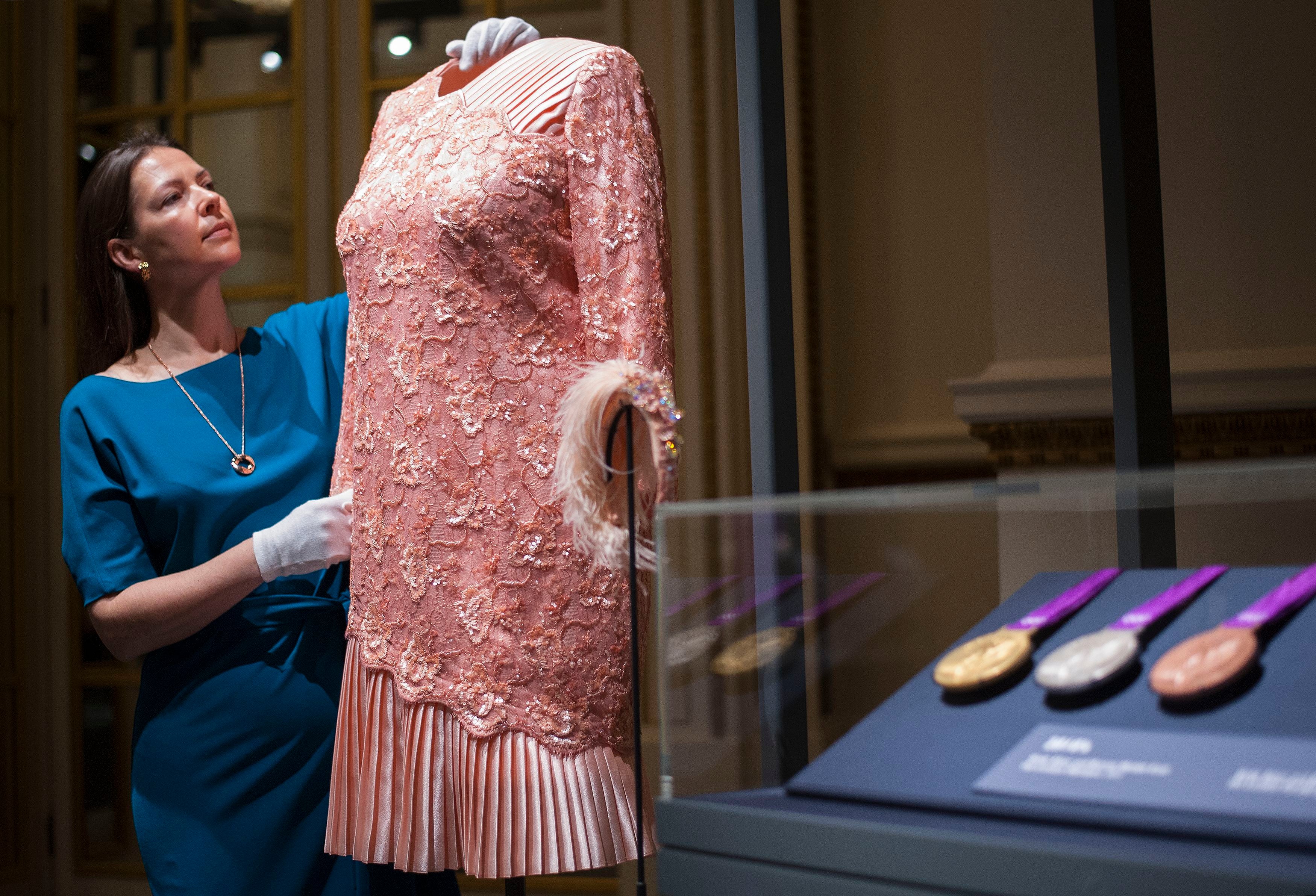 A peach cocktail dress designed by Angela Kelly and worn by Queen Elizabeth II at the opening ceremony of the London 2012 Olympic Games