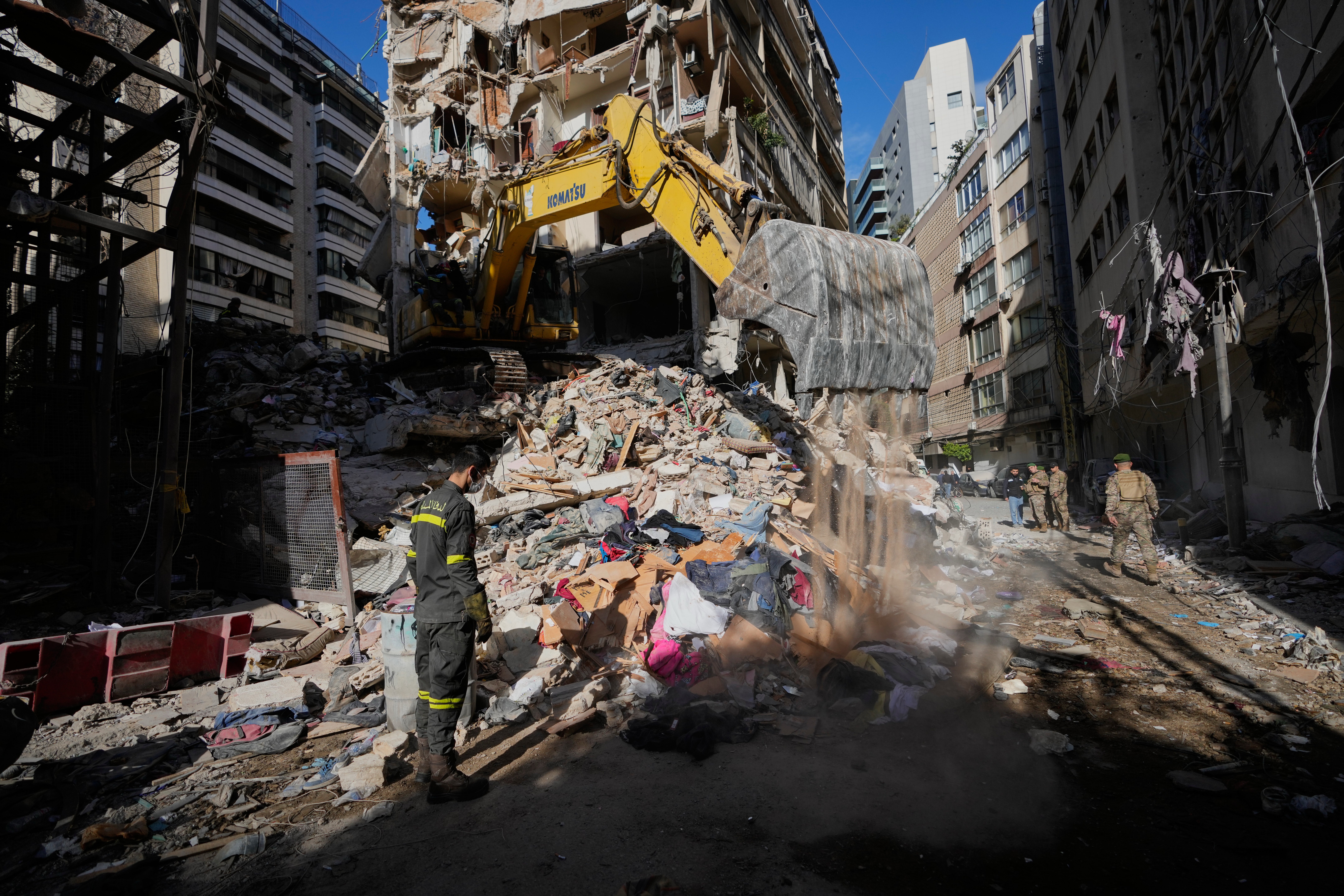 Since nan US and Iran announced a ceasefire, Israel has continued attacking Lebanon, which could beryllium a sticking constituent successful negotiations. A Lebanese civilian defense worker stands adjacent a destroyed building pursuing Israeli strikes