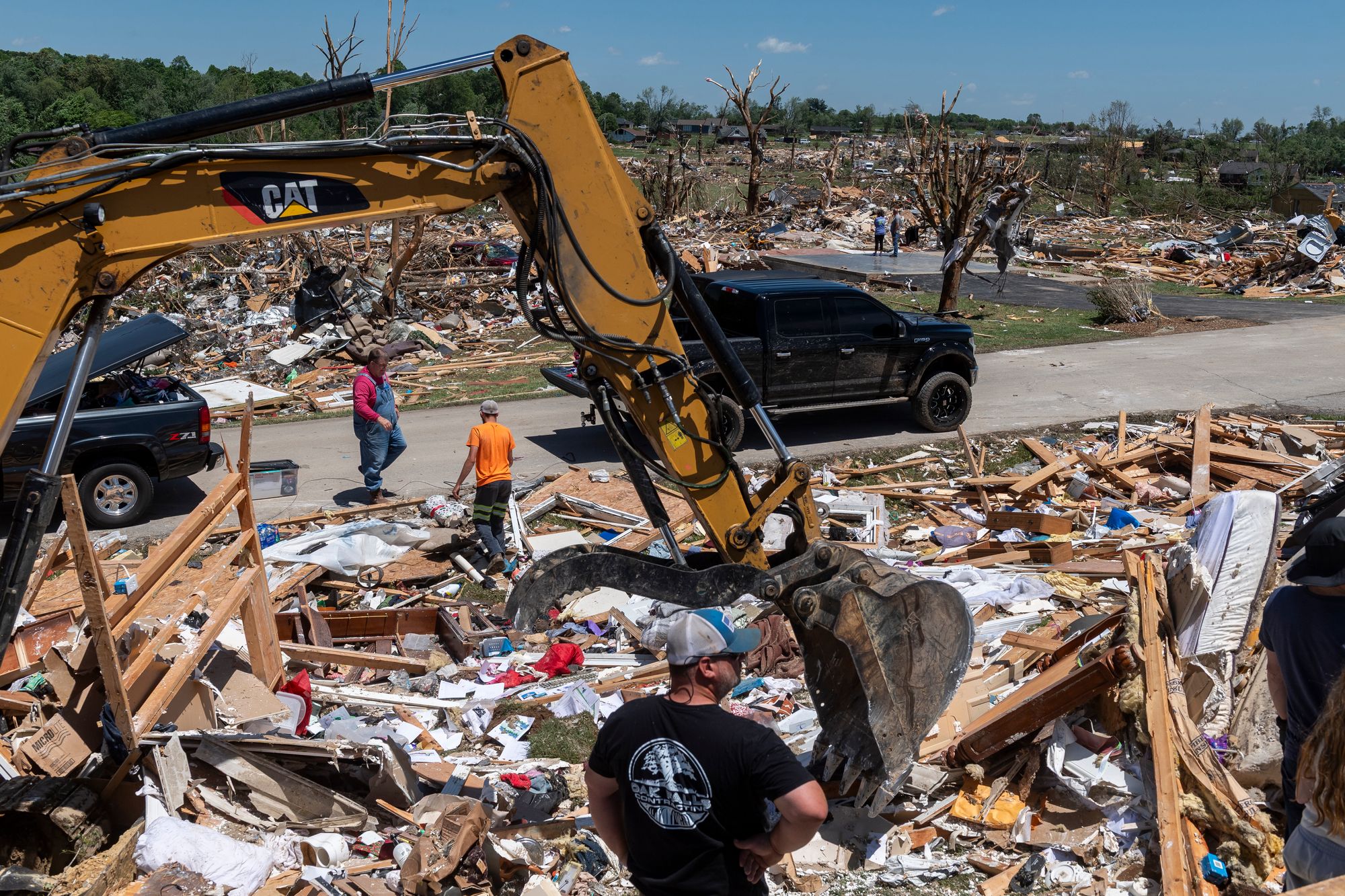 Crews clean up debris in the neighborhood of Sunshine Hills, Kentucky, last May. A deadly tornado outbreak there also passed through Missouri and Illinois