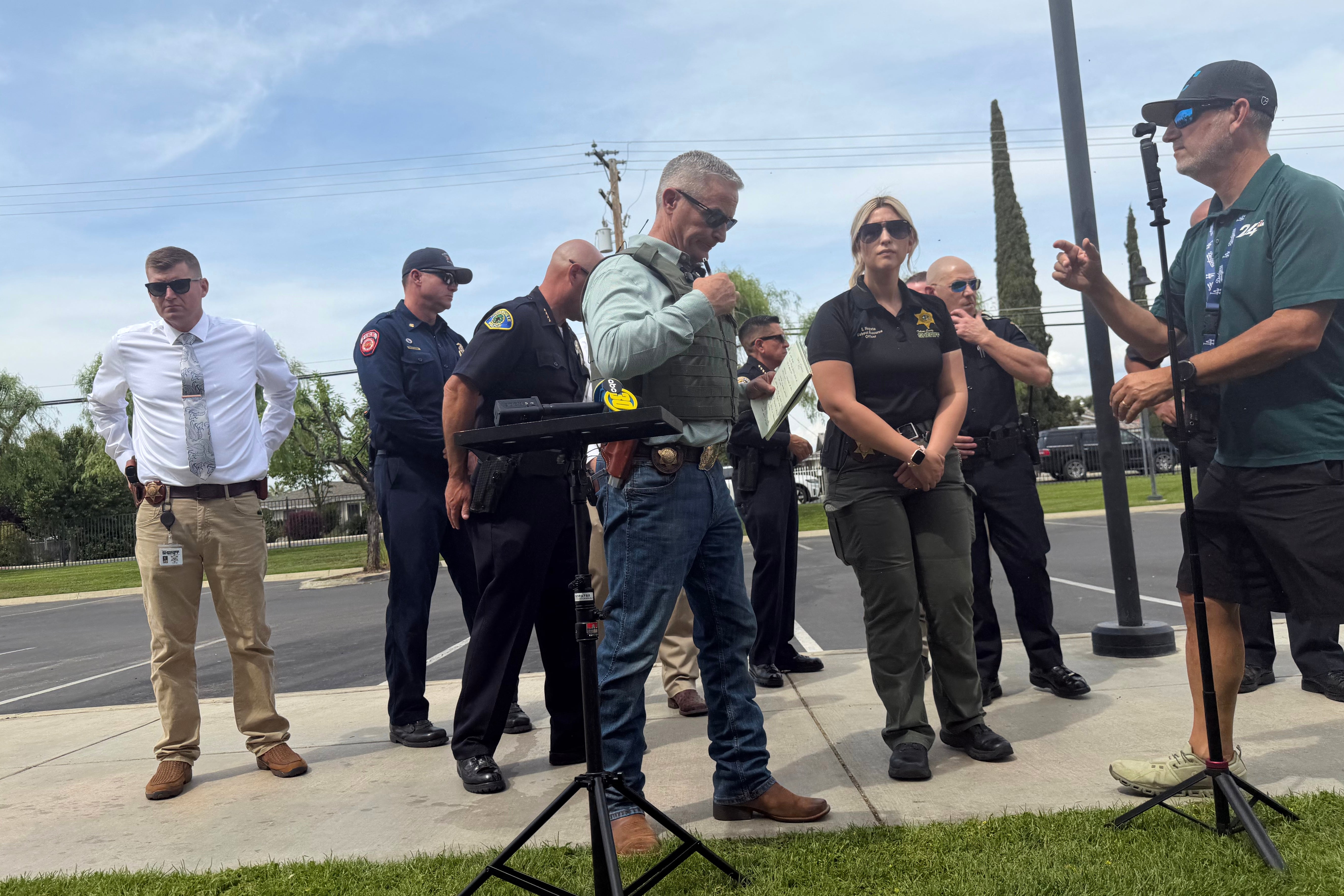Tulare County Sheriff Mike Boudreaux, center, attends a news convention aft a sheriff's lawman was changeable and killed Thursday, April 9, 2026, successful Porterville, Calif. (Tulare County Sheriff's Office via AP)