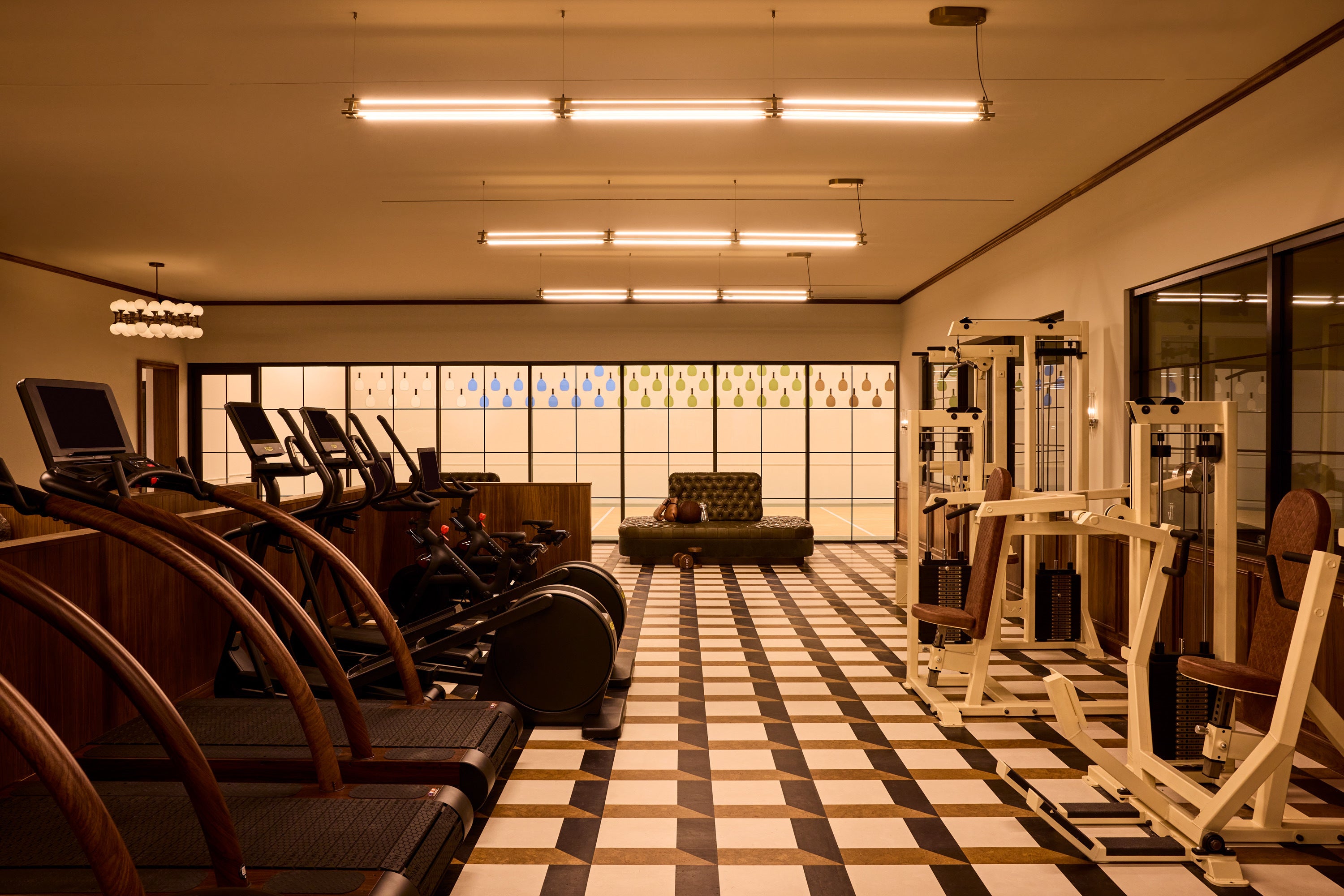 Moss NYC has a two-level wellness space with a massive gym and a pickleball court