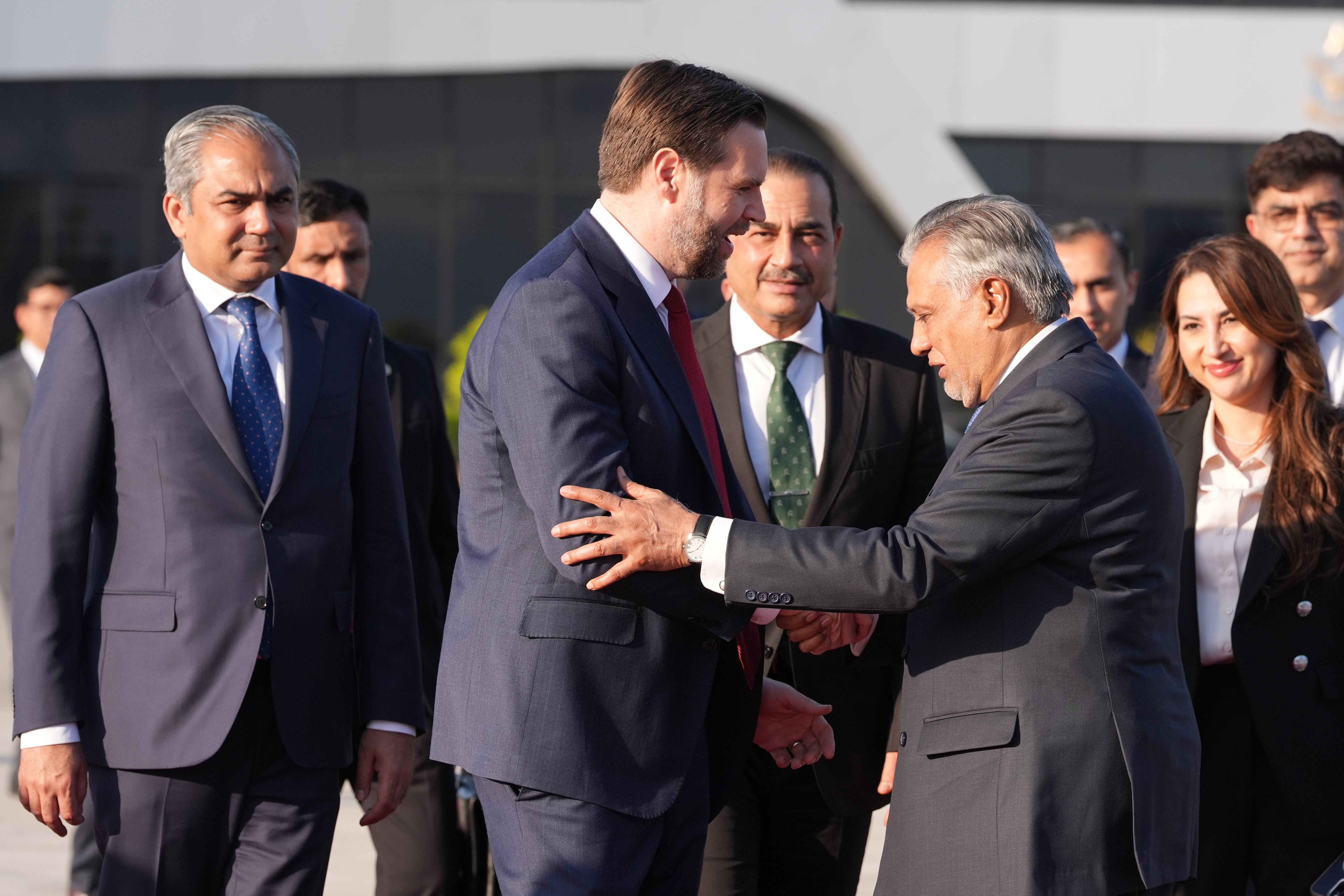 <p>JD Vance shakes hands with Pakistani deputy prime minister and foreign minister Mohammad Ishaq Dar as he prepares to board Air Force Two after attending talks on Iran in Islamabad, on Sunday</p>