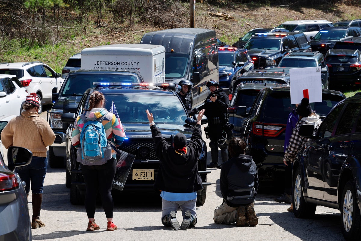 Protesters shot with rubber bullets as they attempt to storm Wisconsin beagle lab