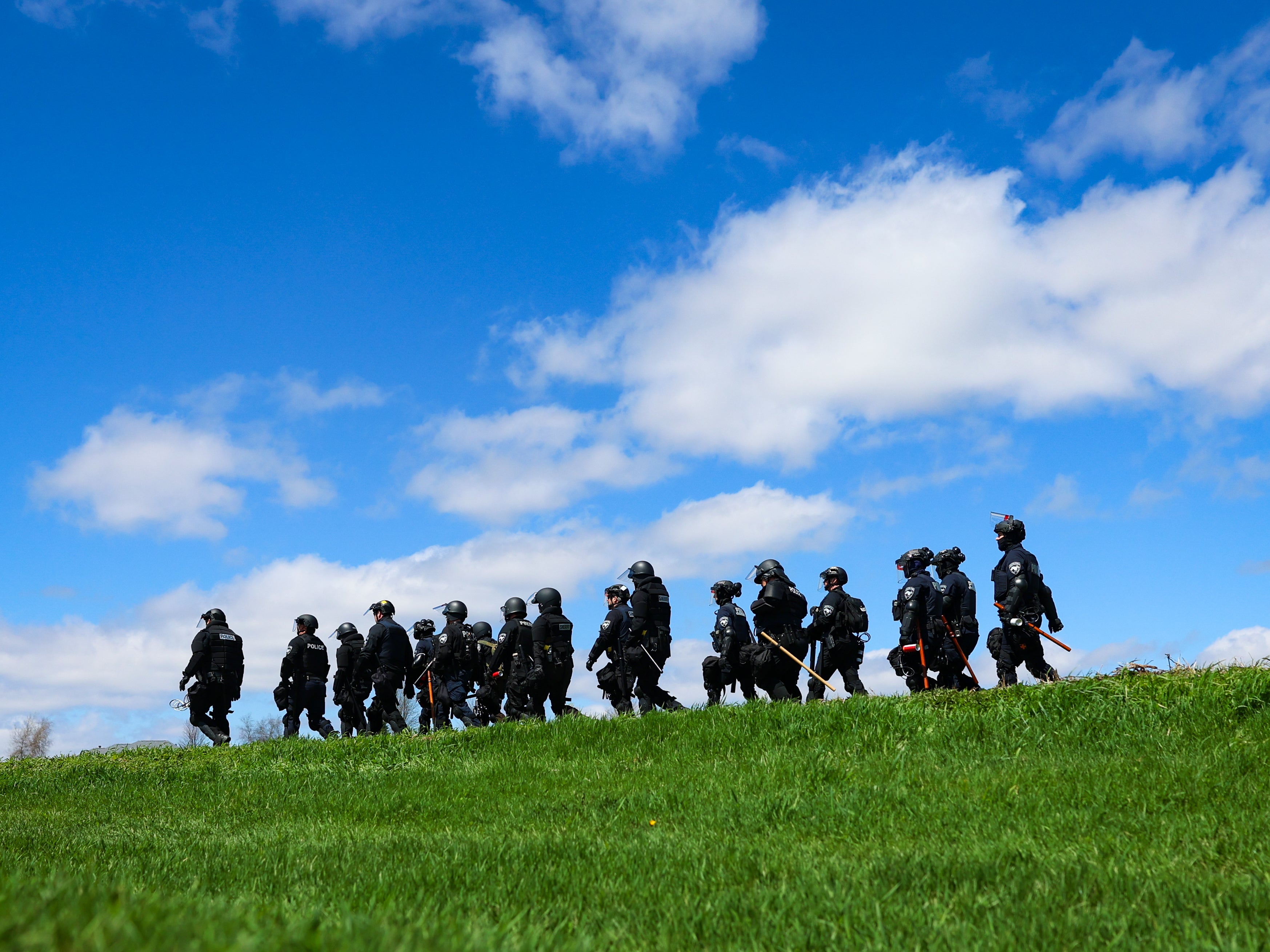 Law enforcement successful riot cogwheel locomotion successful a section aft animal use activists attempted to summation introduction to Ridglan Farms beagle breeding and investigation installation connected Saturday, April 18, 2026, successful Blue Mounds, Wis. (Owen Ziliak/Wisconsin State Journal via AP)