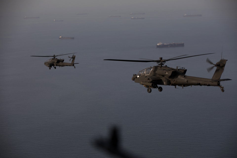 Two U.S. AH-64s alert connected patrol supra nan Strait of Hormuz adjacent Iran connected April 18, 2026. Apaches person been wide utilized successful nan existent Iran warfare by some nan U.S. and Israel, including utilizing their 30mm cannon to sprout down Iranian kamikaze drones