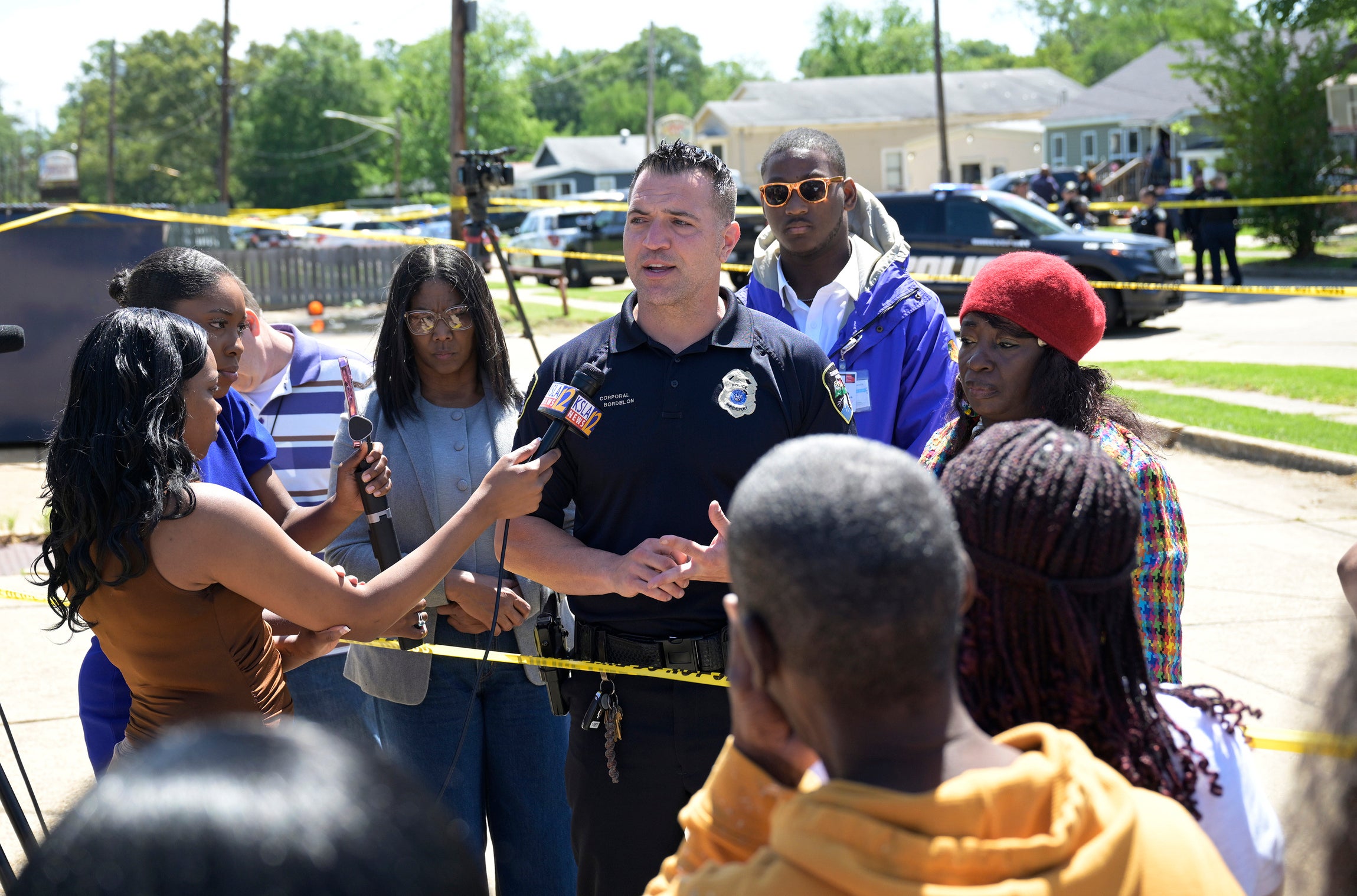 Shreveport Police Department spokesperson Chris Bordelon (center) addressing the press