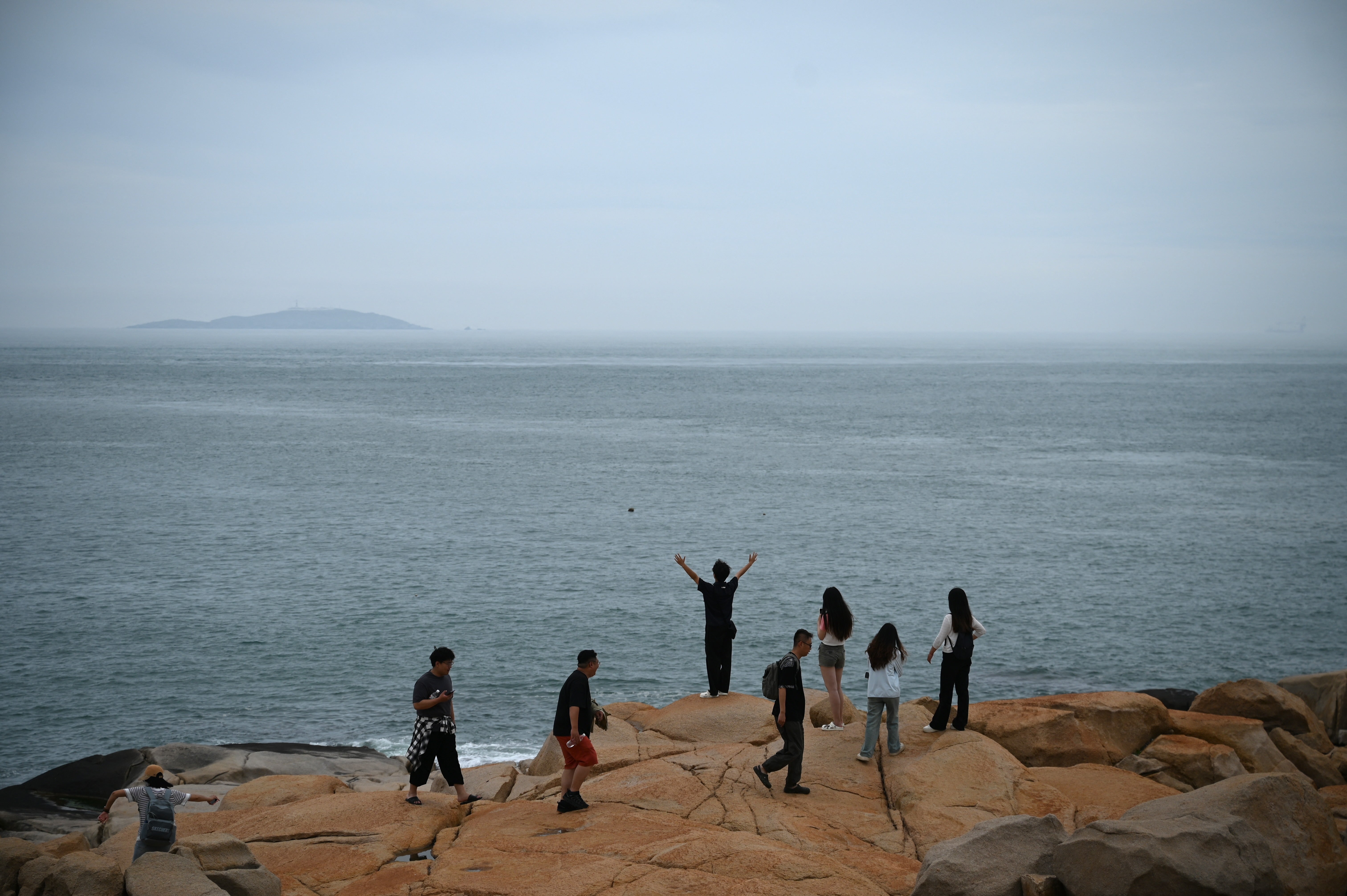 People look retired to nan Taiwan strait astatine a tourer spot called "68 Nautical Miles" connected Pingtan island, nan closest constituent successful China to Taiwan's main island