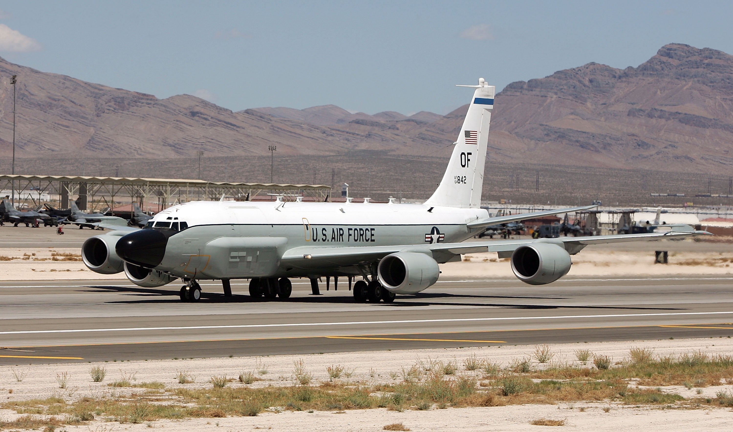 A United States Air Force RC-135 RIVET JOINT aircraft takes off from Nellis Air Force Base while participating in the Joint Expeditionary Force Experiment 2006 April 25, 2006 in Las Vegas, Nevada
