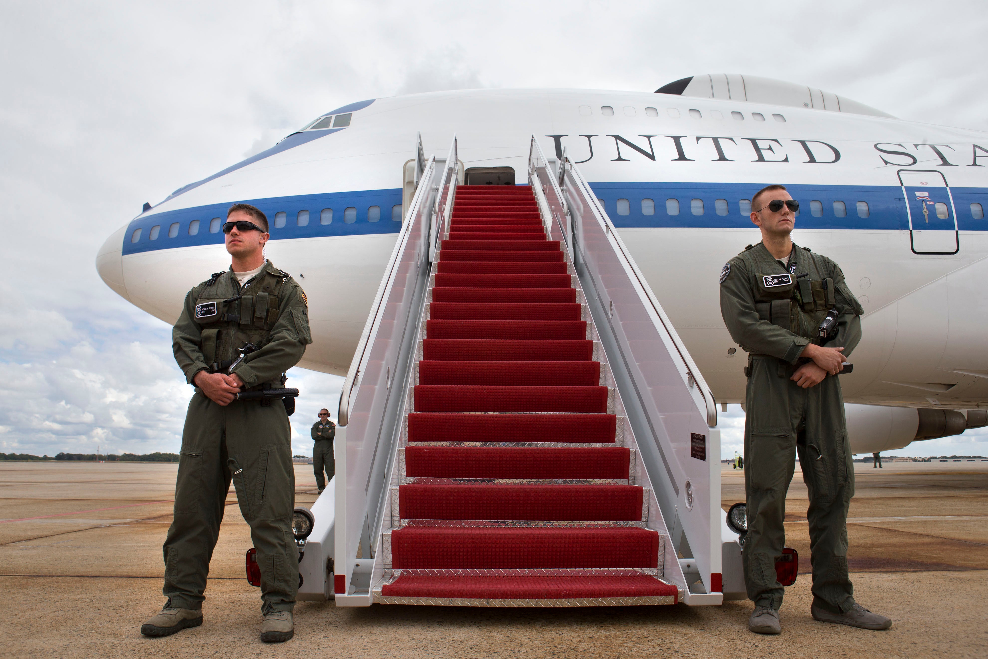 Members of the U.S. Air Combat Command Security Forces guard the E-4B plane awaiting U.S. Secretary of Defense Chuck Hagel to arrive September 28, 2013 at Andrews Air Force Base, Maryland