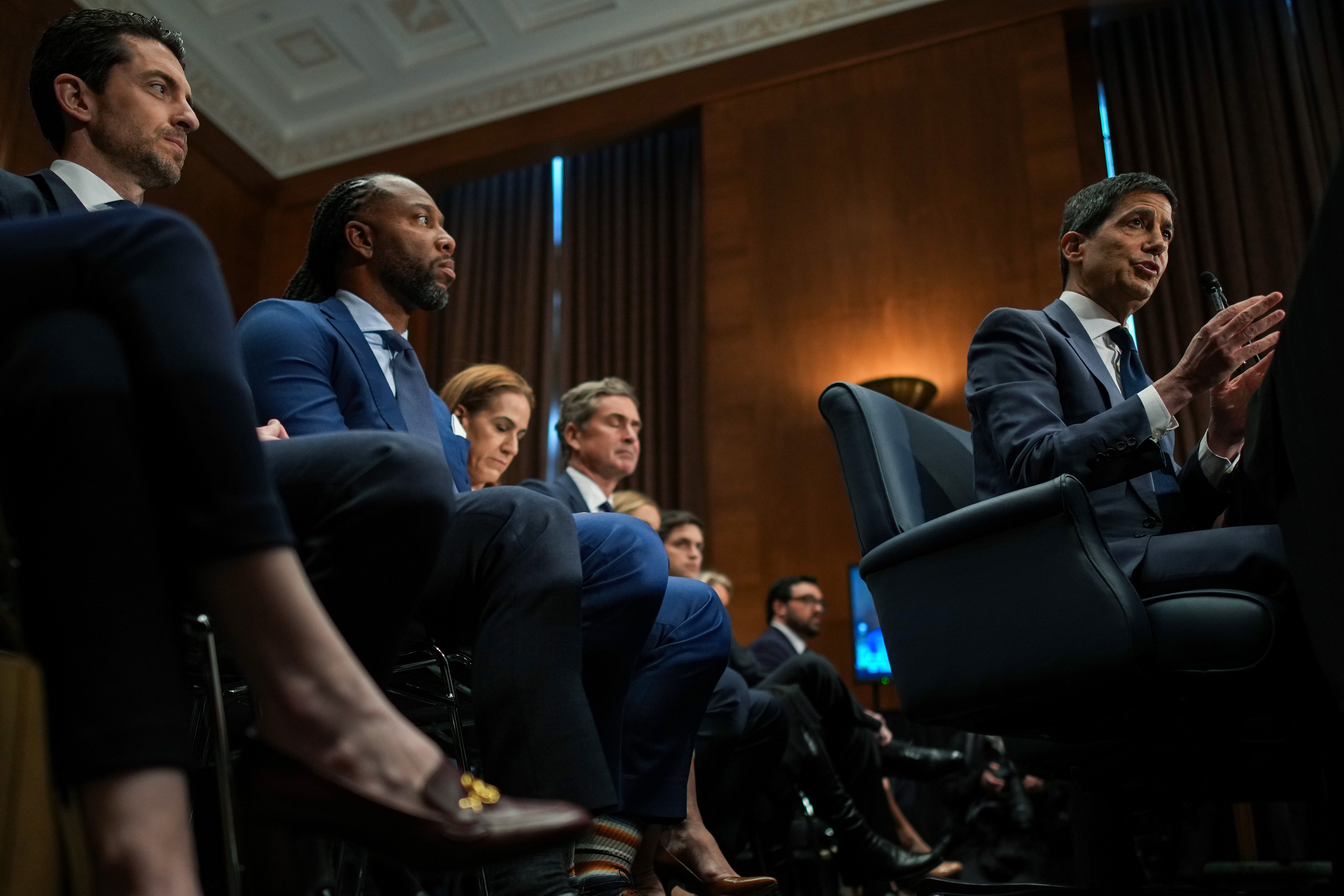 Kevin Warsh. President Donald Trump's nominee for Chair of nan Federal Reserve, testifies arsenic erstwhile NFL subordinate Larry Fitzgerald Jr. (left) looks connected during his Senate Committee connected Banking, Housing, and Urban Affairs confirmation proceeding successful nan Dirksen Senate Office Building connected April 21