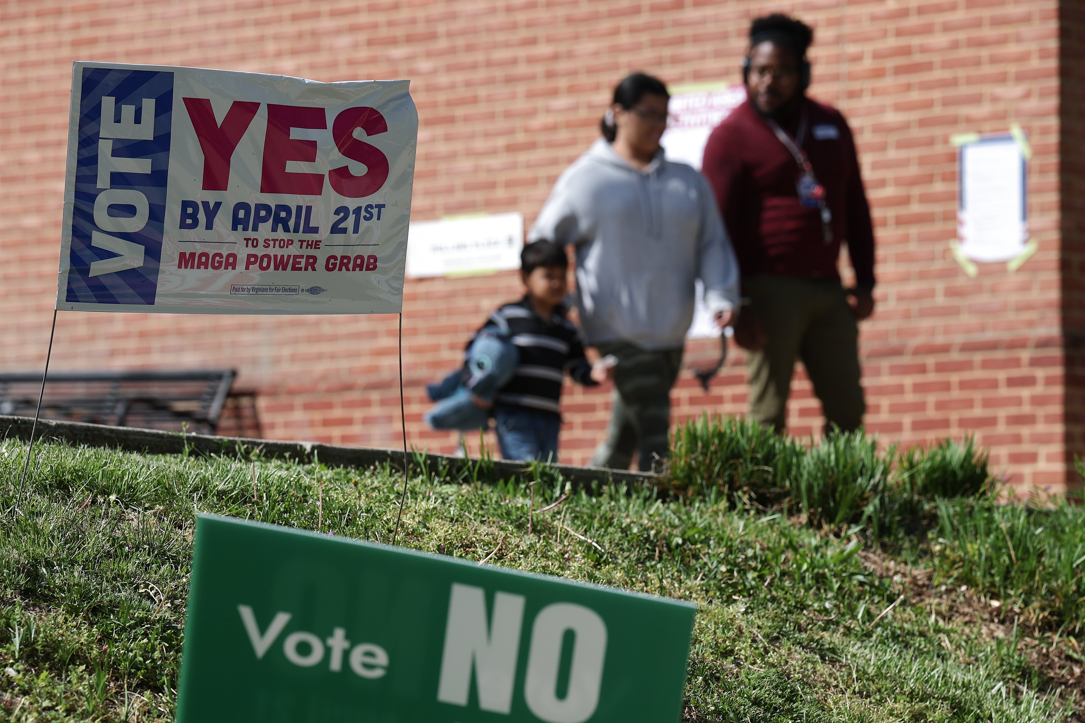 Voters depart aft casting their ballots astatine a polling location astatine nan Westover Library connected April 21
