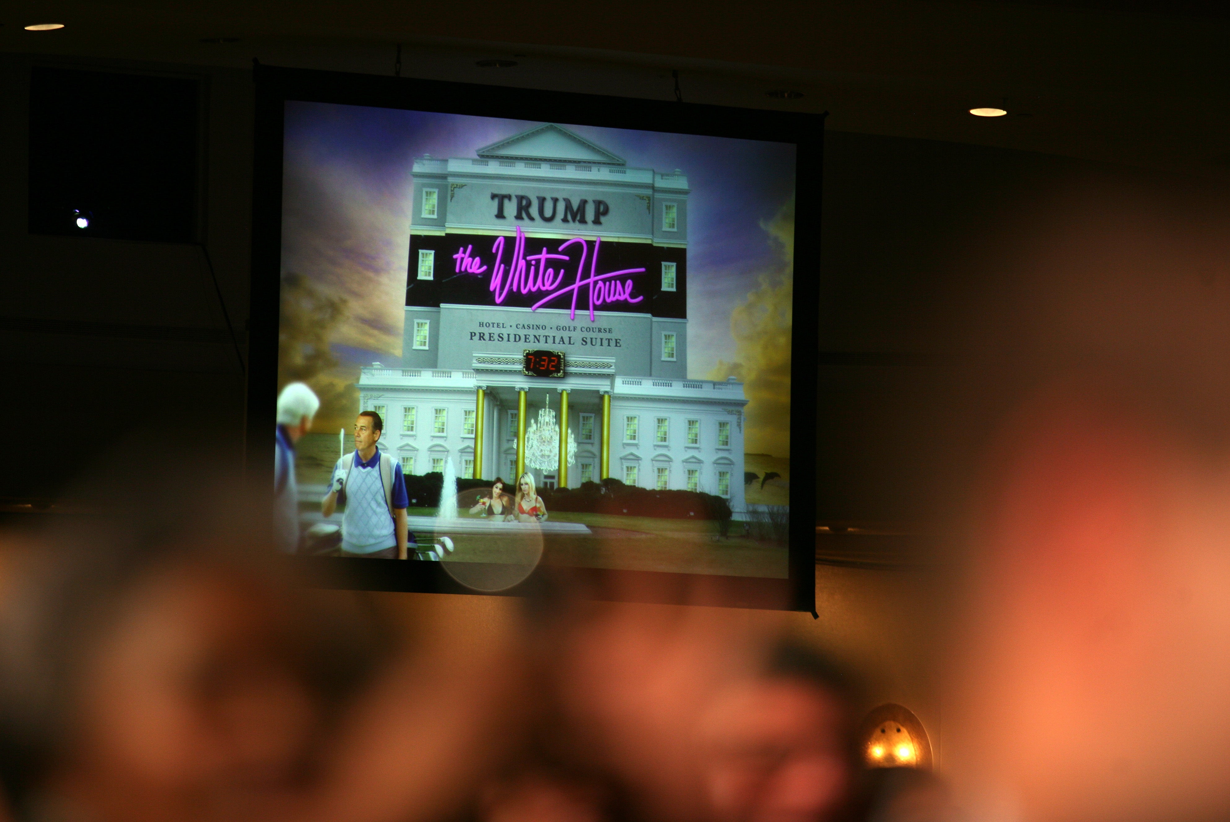 A projected image is shown connected a ample surface during Barack Obama's reside astatine nan 2011 meal which Obama utilized to show what a ‘Trump’ White House mightiness look like