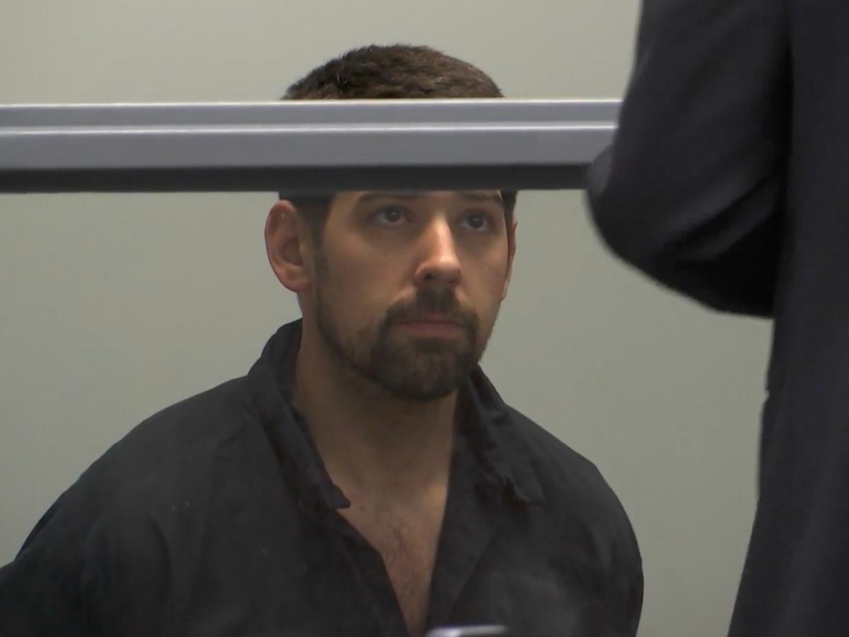 Jeffrey MacDonald, 36, is charged with murder and assault and battery upon a police officer after his wife was found dead at a UMass campus hotel