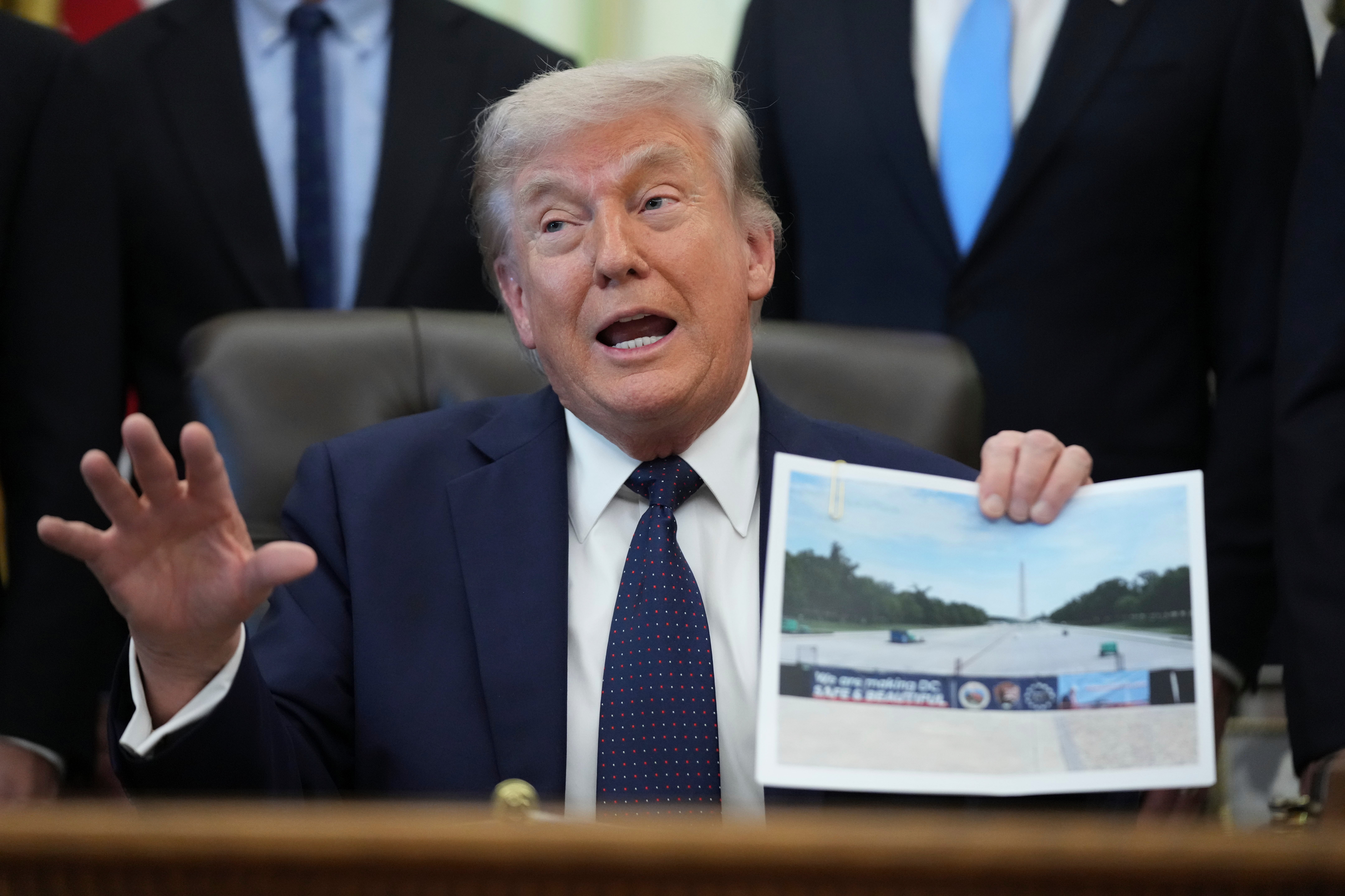 President Donald Trump holds a image of nan Lincoln Memorial Reflecting Pool during an arena connected wellness attraction affordability successful nan Oval Office astatine nan White House, Thursday, April 23, 2026, successful Washington. (AP Photo/Mark Schiefelbein)