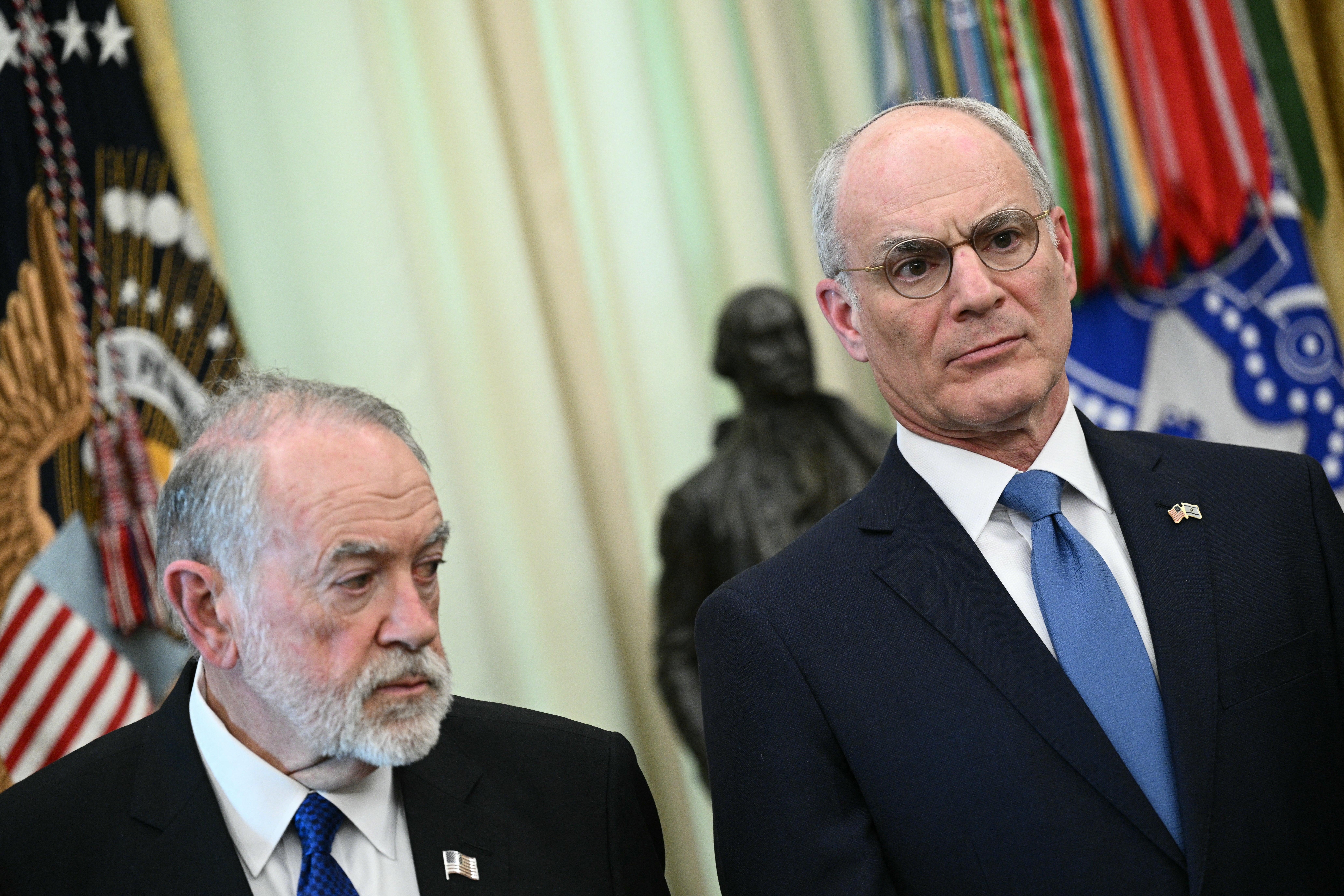 (L-R) US Ambassador to Israel Mike Huckabee and Israel Ambassador to US Yechiel Leiter perceive arsenic US President Donald Trump speaks