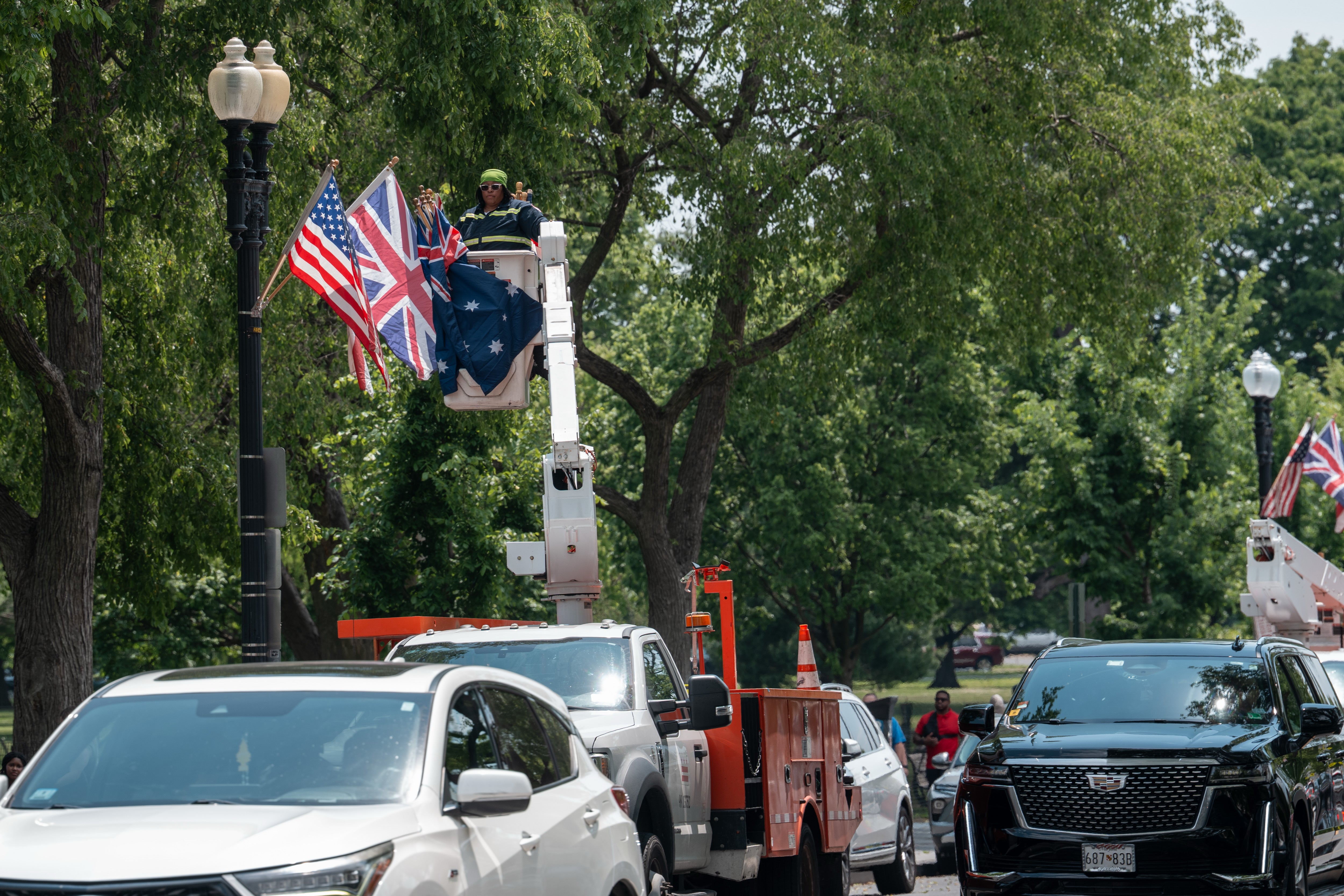 Photos show clusters of Australian flags lining lamp achromatic lamp posts adjacent nan White House