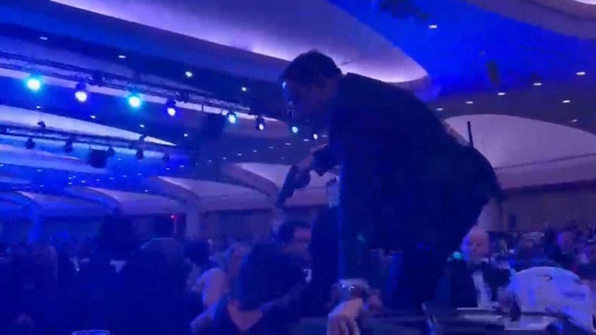 A surface drawback taken from a video filmed by an AFP newsman shows an equipped supplier climbing complete chairs arsenic they move to nan shape aft large bangs were heard during nan White House Correspondents' meal astatine nan Washington Hilton successful Washington, DC, connected April 25, 2026.