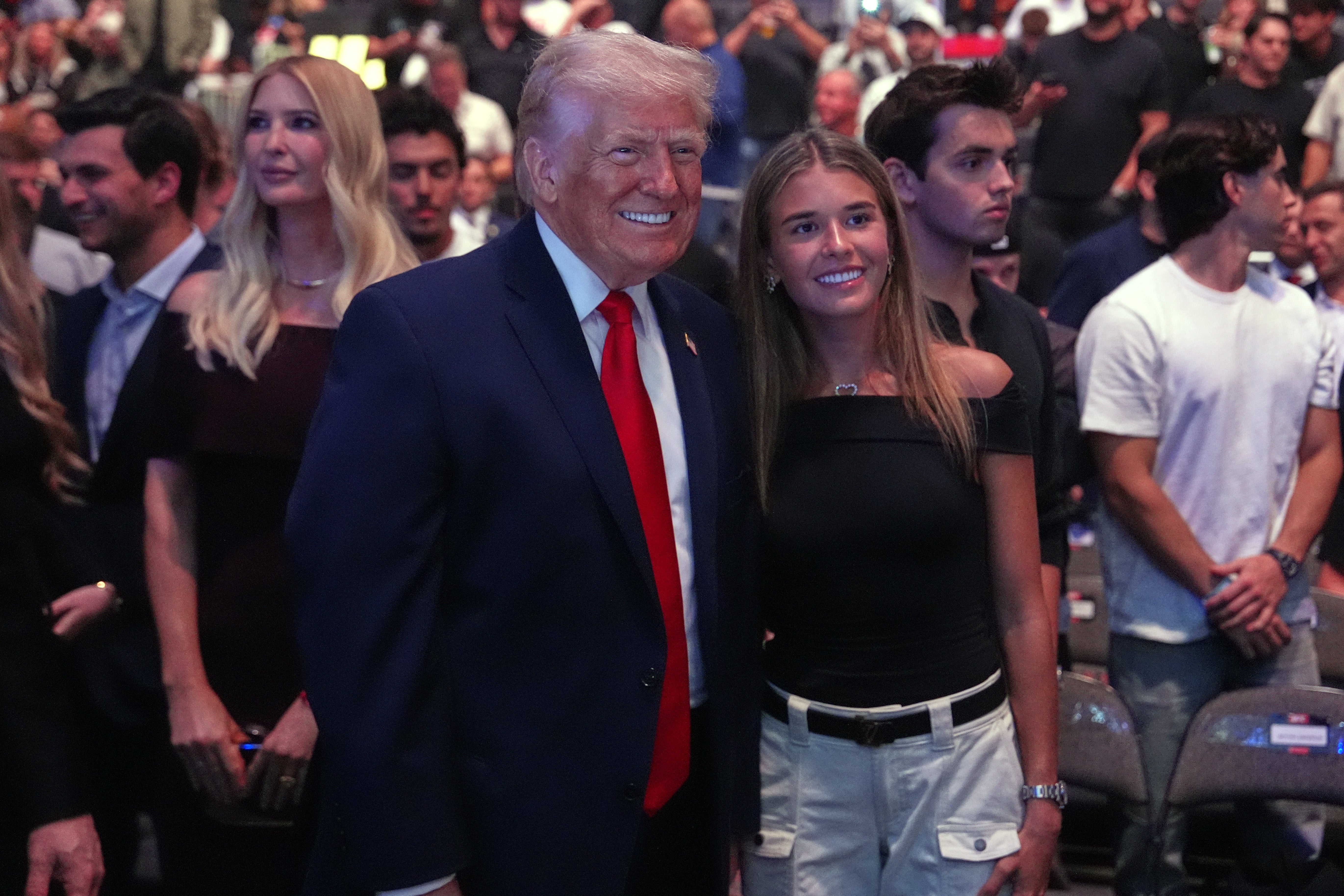 U.S. President Donald Trump poses for photos pinch Kai Trump during UFC 327 astatine Kaseya Center connected April 11, 2026 successful Miami, Florida.