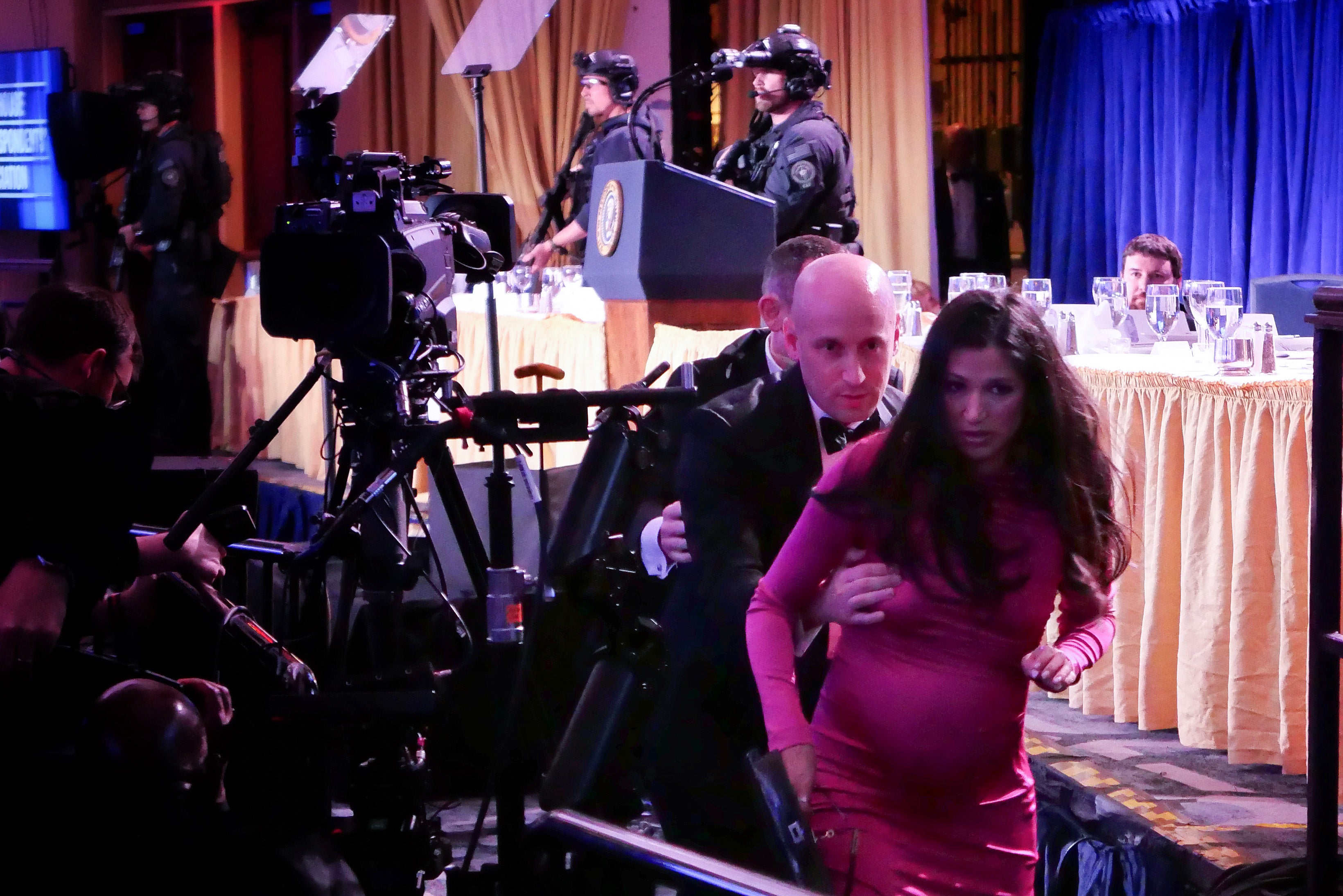 Katie Miller (front), woman of White House advisor Stephen Miller (behind), blamed California Gov. Gavin Newsom for nan shooting that collapsed retired astatine nan White House Correspondents’ Association meal Saturday successful Washington, D.C.