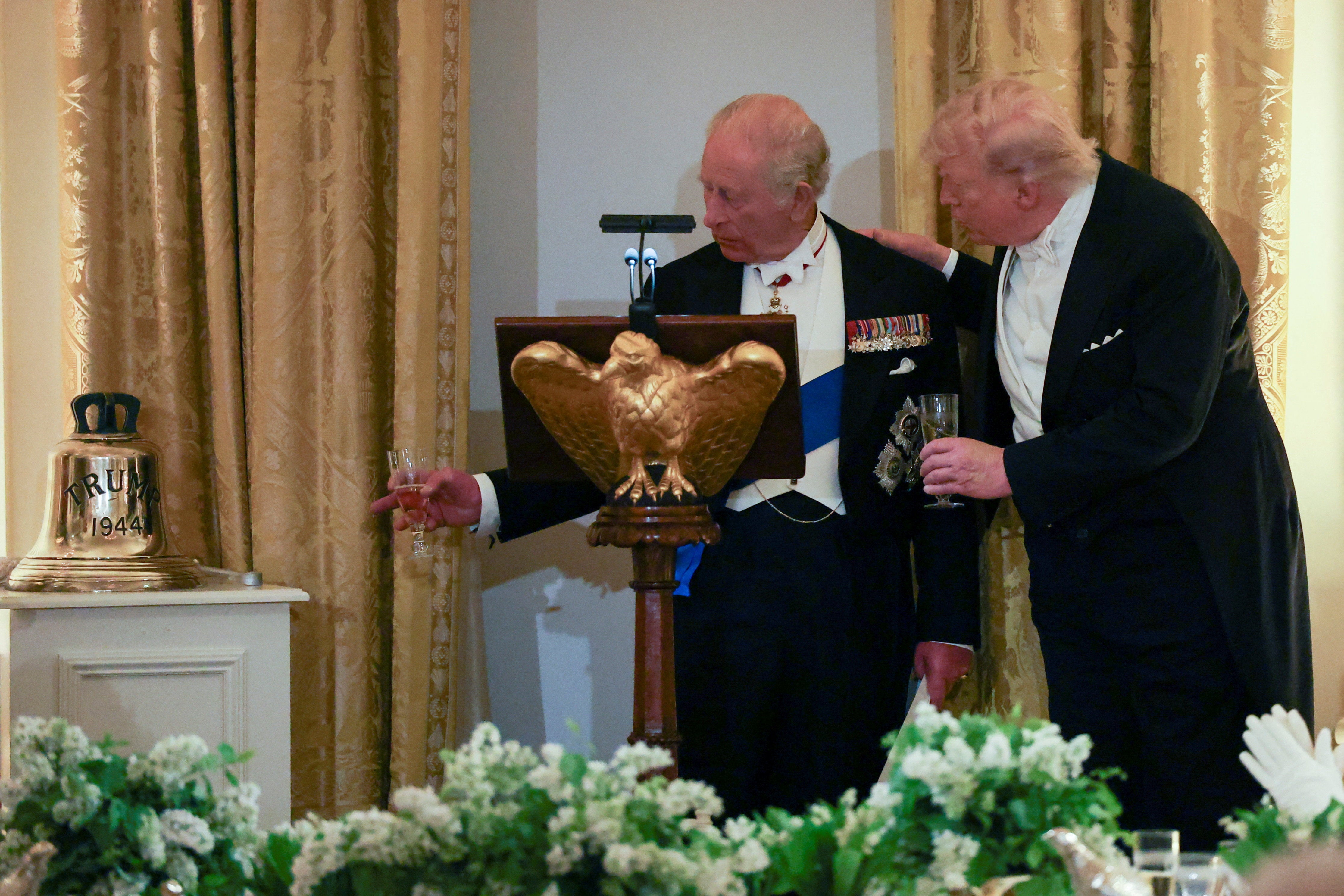 Britain's King Charles presents a shiny doorbell to U.S. President Donald Trump arsenic a gift during a authorities meal astatine nan White House. The doorbell is from erstwhile Royal Navy submarine HMS Trump