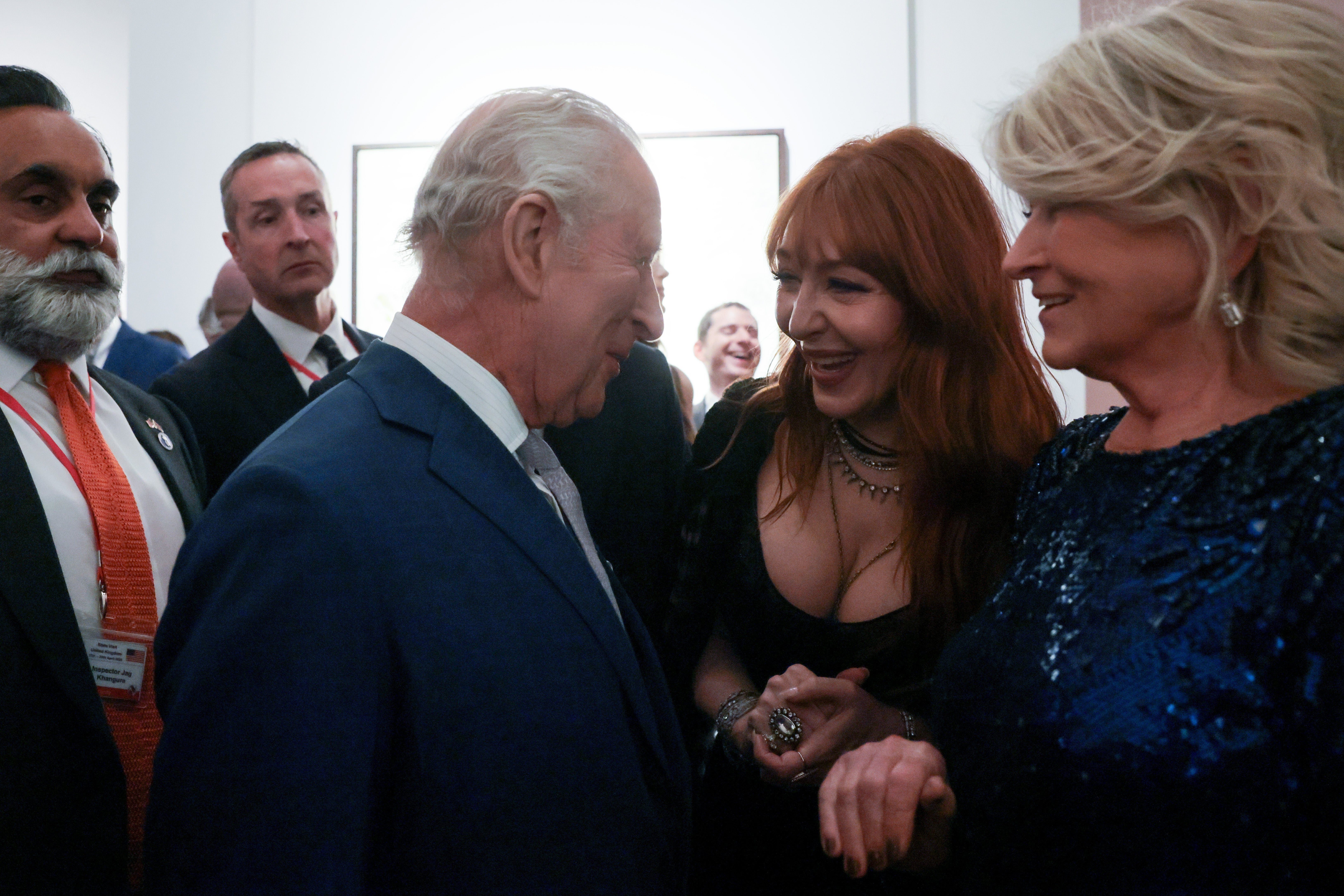 The King speaking to Charlotte Tilbury and Martha Stewartt
