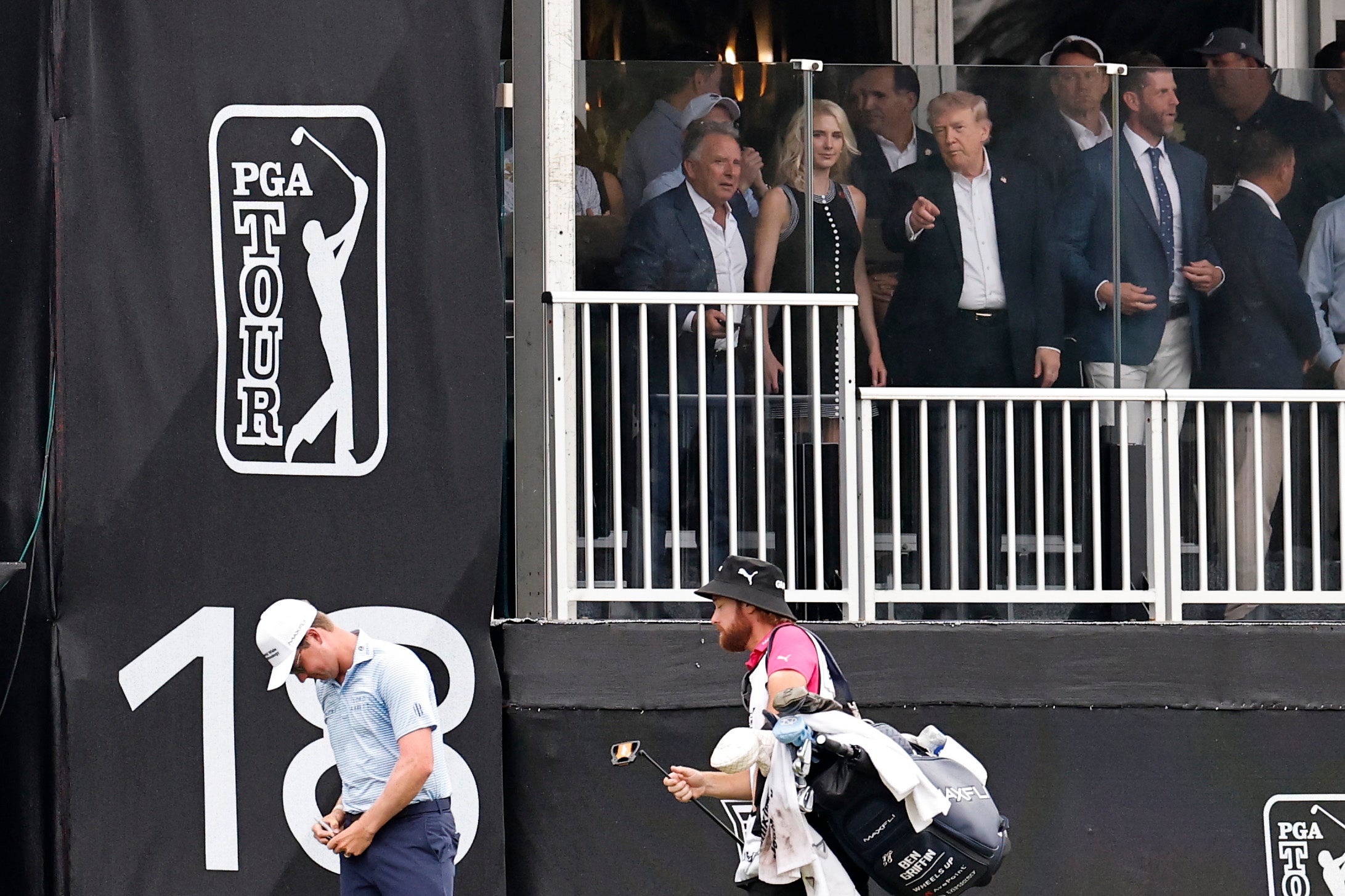 The president viewed nan arena from a spectator’s container and watched golfer Cameron Young’s last changeable from nan 18th hole