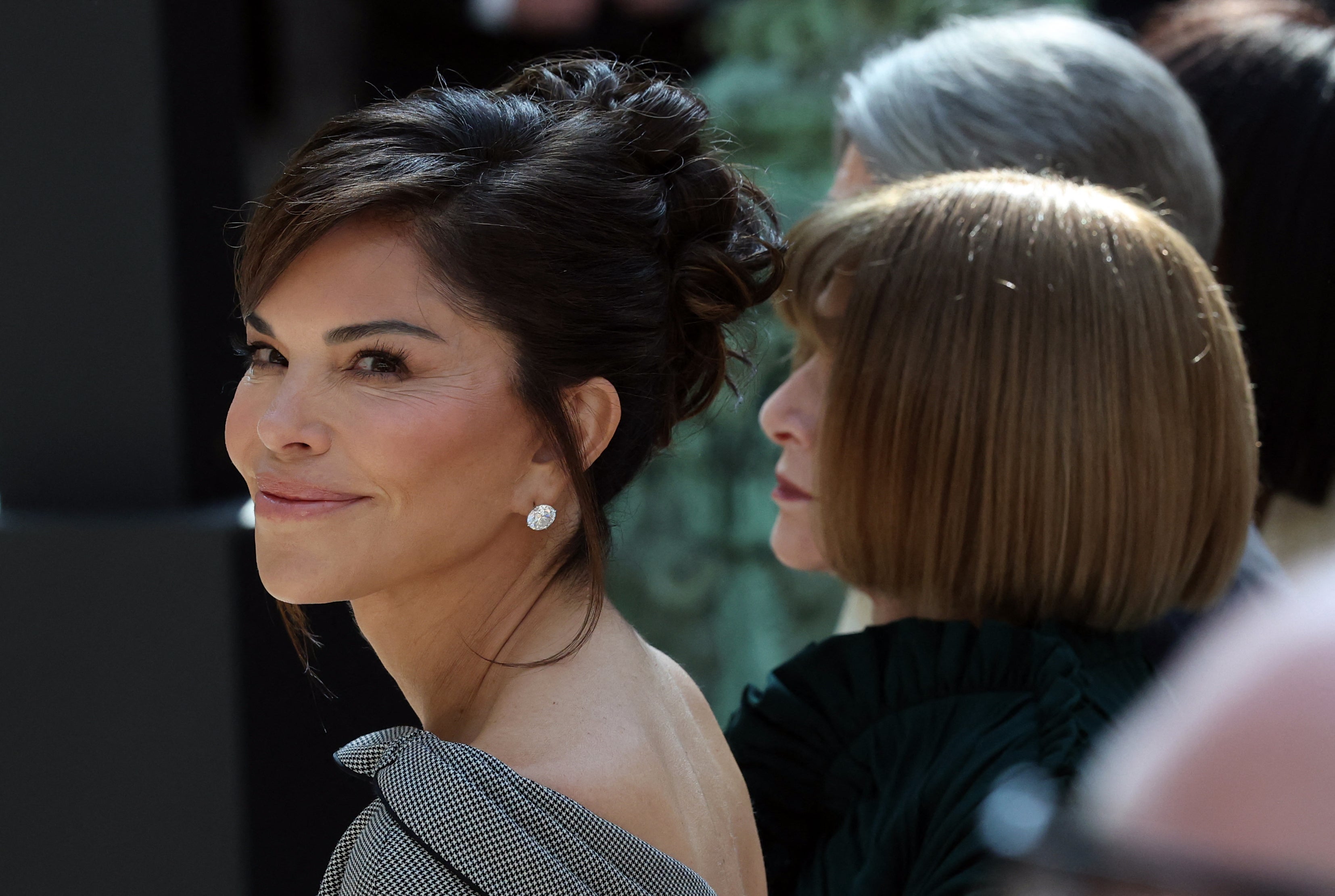 Mrs Bezos appeared in the front row at a Monday press conference next to Vogue executive Anna Wintour