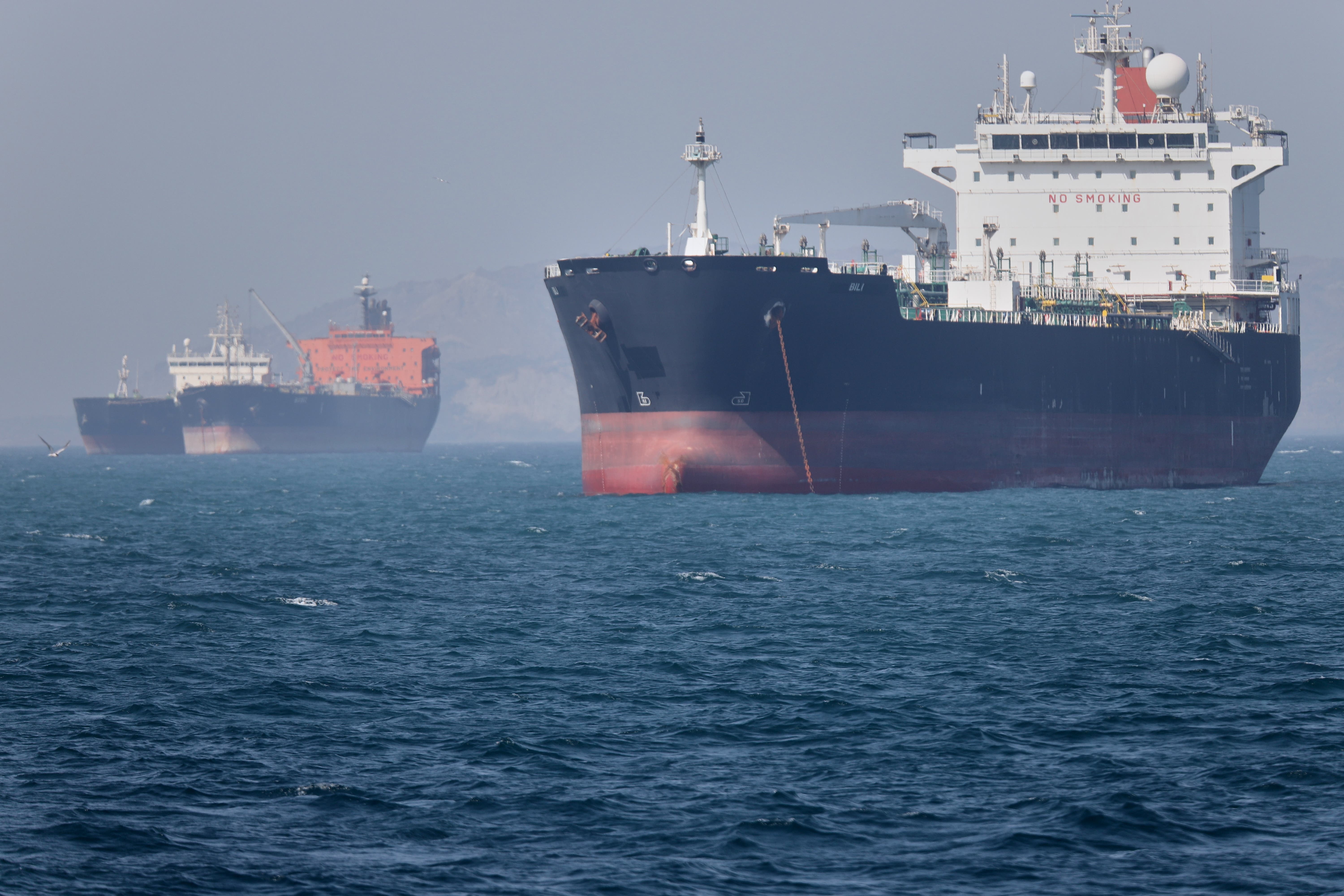 Oil ships stay stranded successful nan Strait of Hormuz, which has caused world substance prices to spike