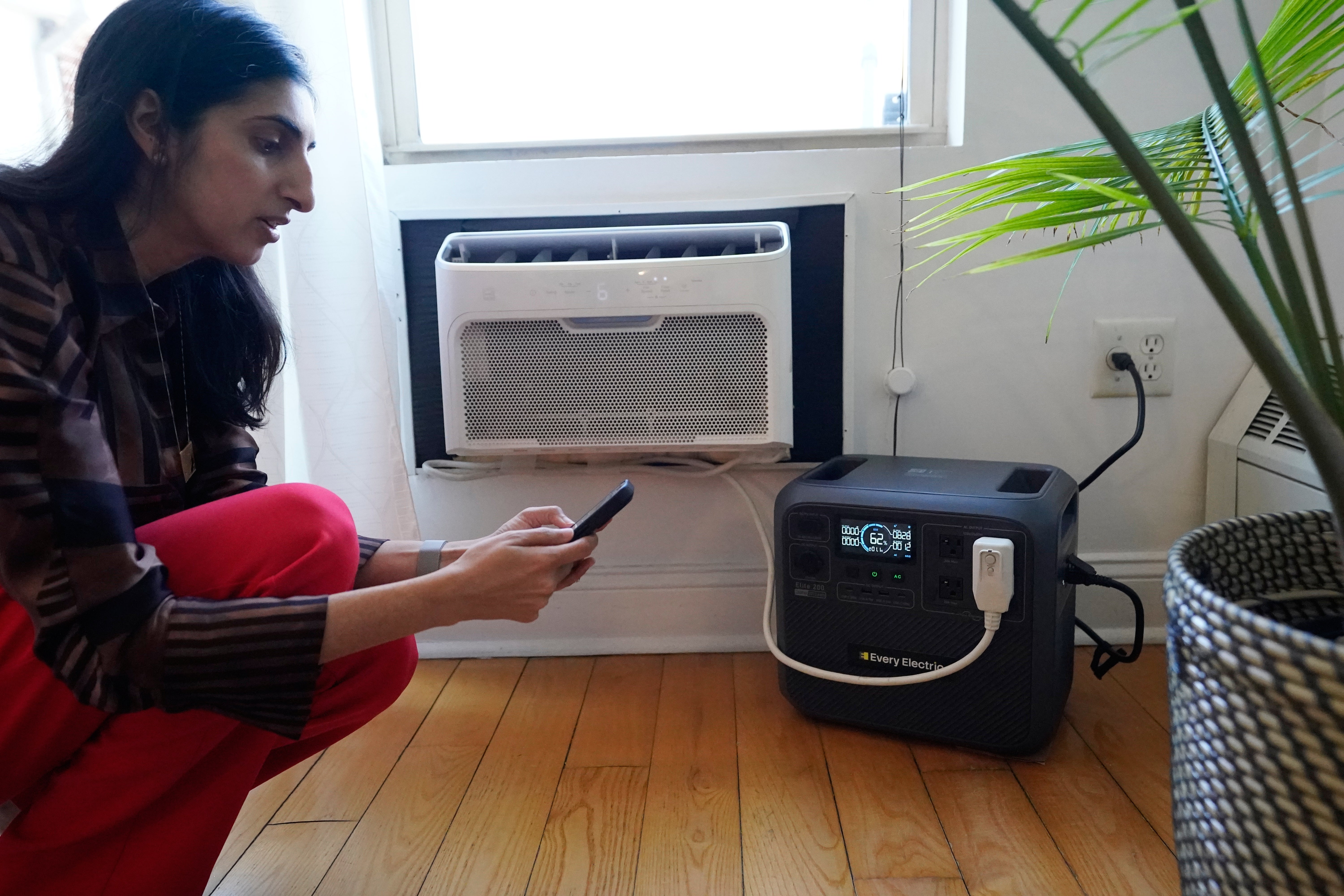 Sonam Velani hooks up a artillery from Every Electric to powerfulness an aerial conditioner arsenic portion of a aviator programme pinch nan city's power institution Con Edison