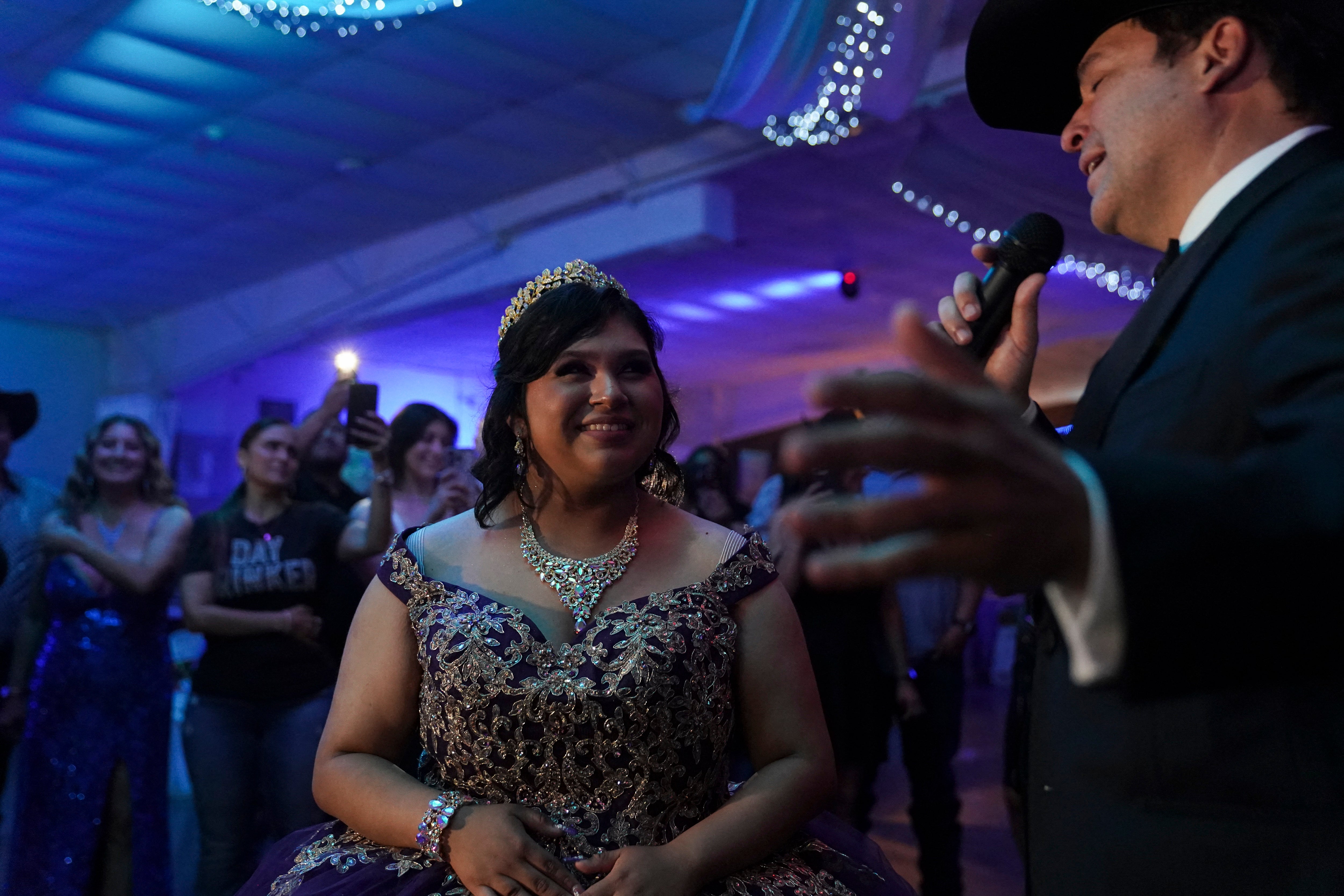 Latin Grammy victor and Democrat campaigner for Texas' 15th Congressional District Bobby Pulido, sings to Melanie Nieto, 15, astatine her quinceanera statement successful Edinburg, Texas, connected March 14, 2026. (Photo by Gabriel V. Cardenas / POOL / AFP via Getty Images)