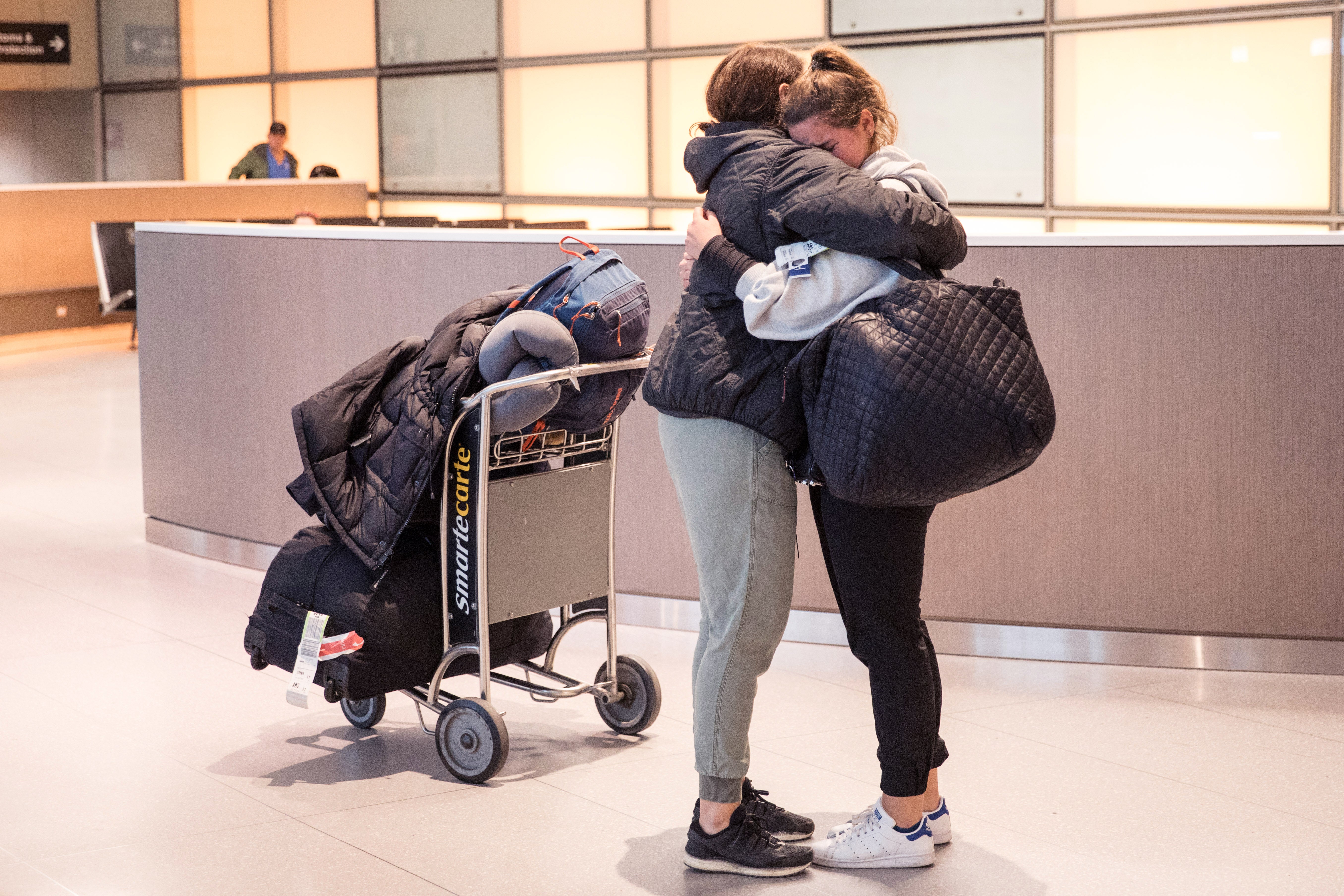 A daughter hugs her mother at Logan Airport in Boston, Massachusetts. People who don’t have voicemails of their mothers can still be comforted through their memory