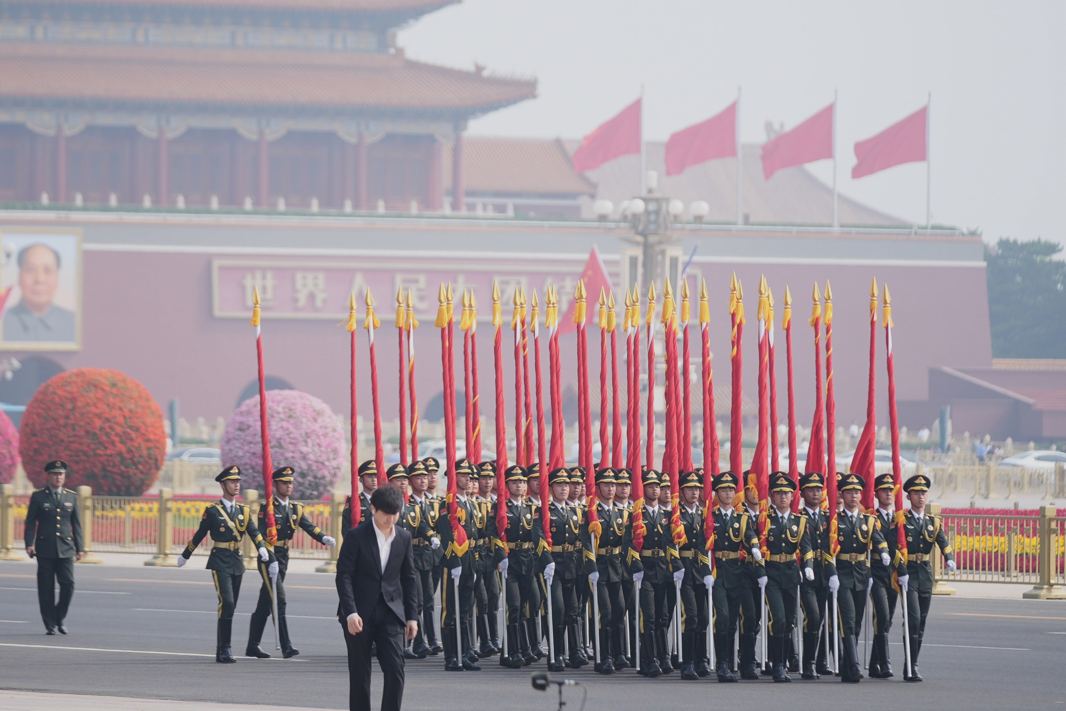 Members of nan subject rehearse earlier President Donald Trump is greeted by Chinese President Xi Jinping astatine a invited ceremonial astatine nan Great Hall of nan People, Thursday