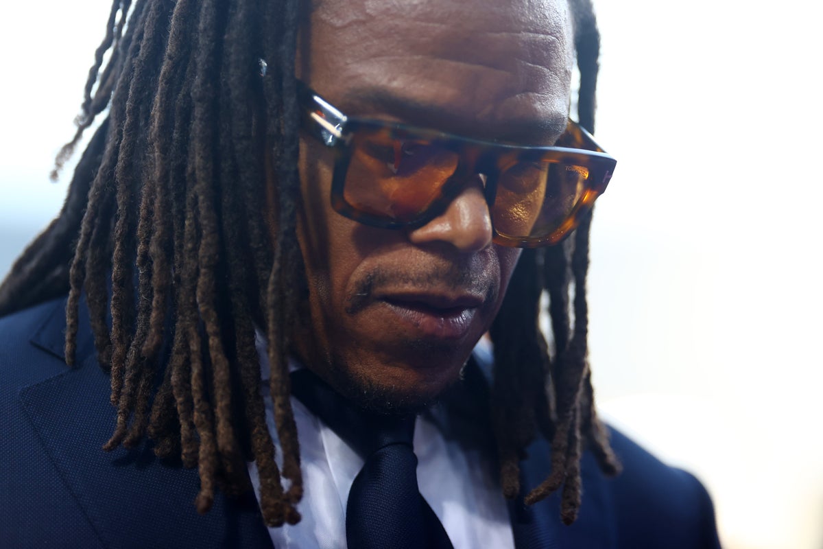 Woman who pawned Edgar Davids' £118,000 art collection misses court after being ‘knocked out by luggage'