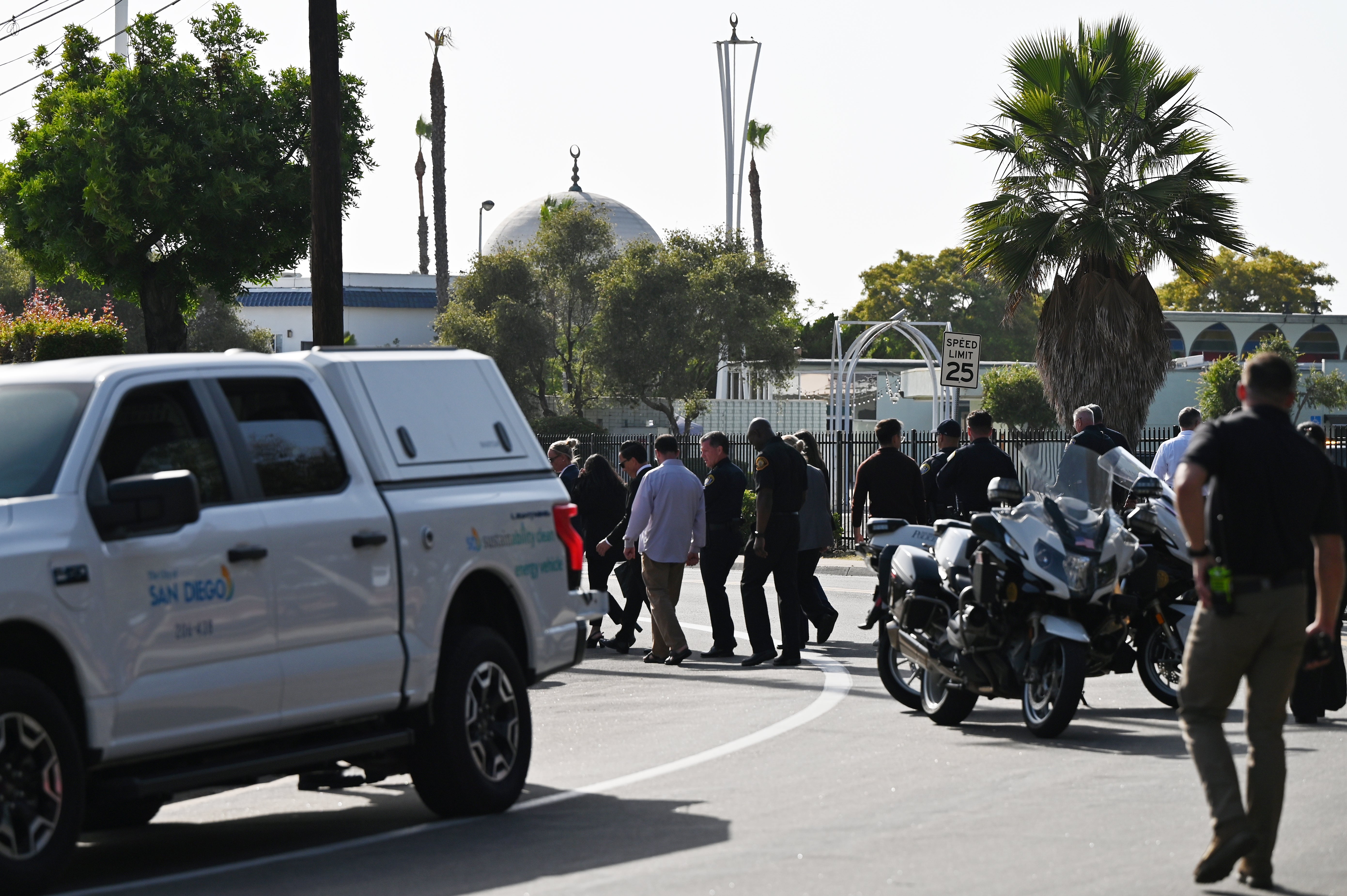 A gun scrawled with 'hate speech' was reportedly found near the scene