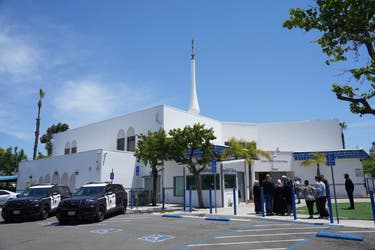<p>Police cars at the Islamic Center of San Diego, the scene of a deadly attack earlier this week in which three people were fatally shot by teen gunmen who then took their own lives</p>