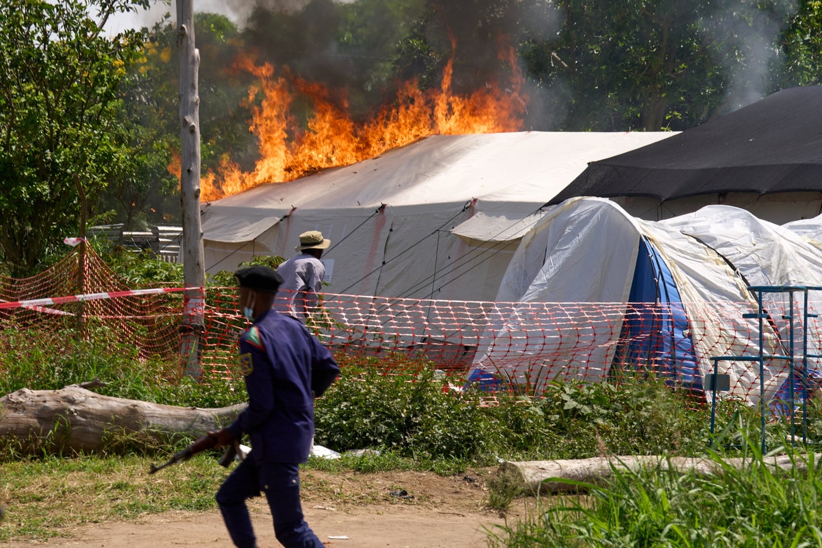 Local residents set Ebola treatment centre on fire in Congo as anger grows over outbreak