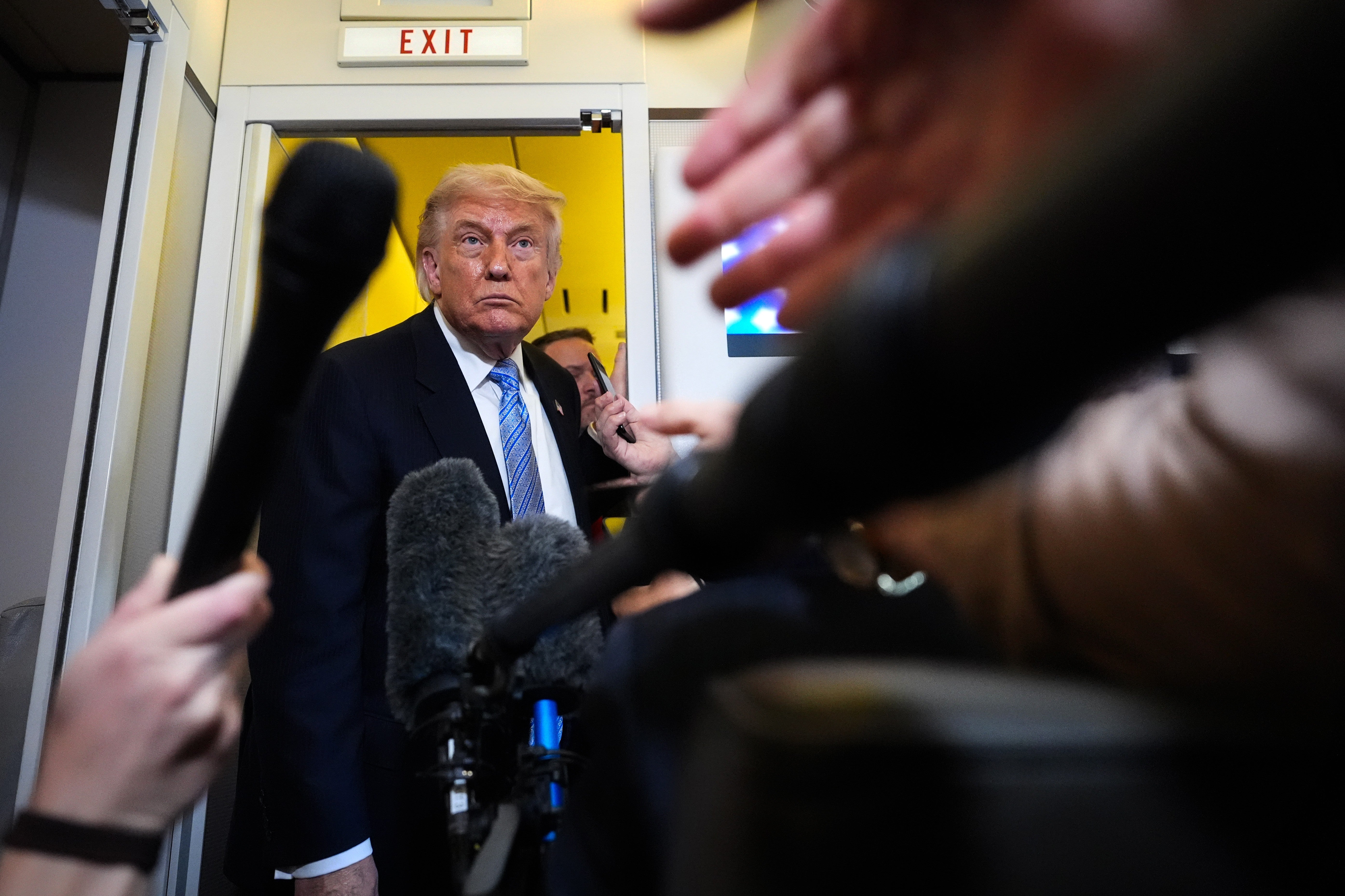 President Donald Trump speaks to reporters aboard Air Force One, Friday, May 15, 2026, arsenic he returns from a travel to Beijing