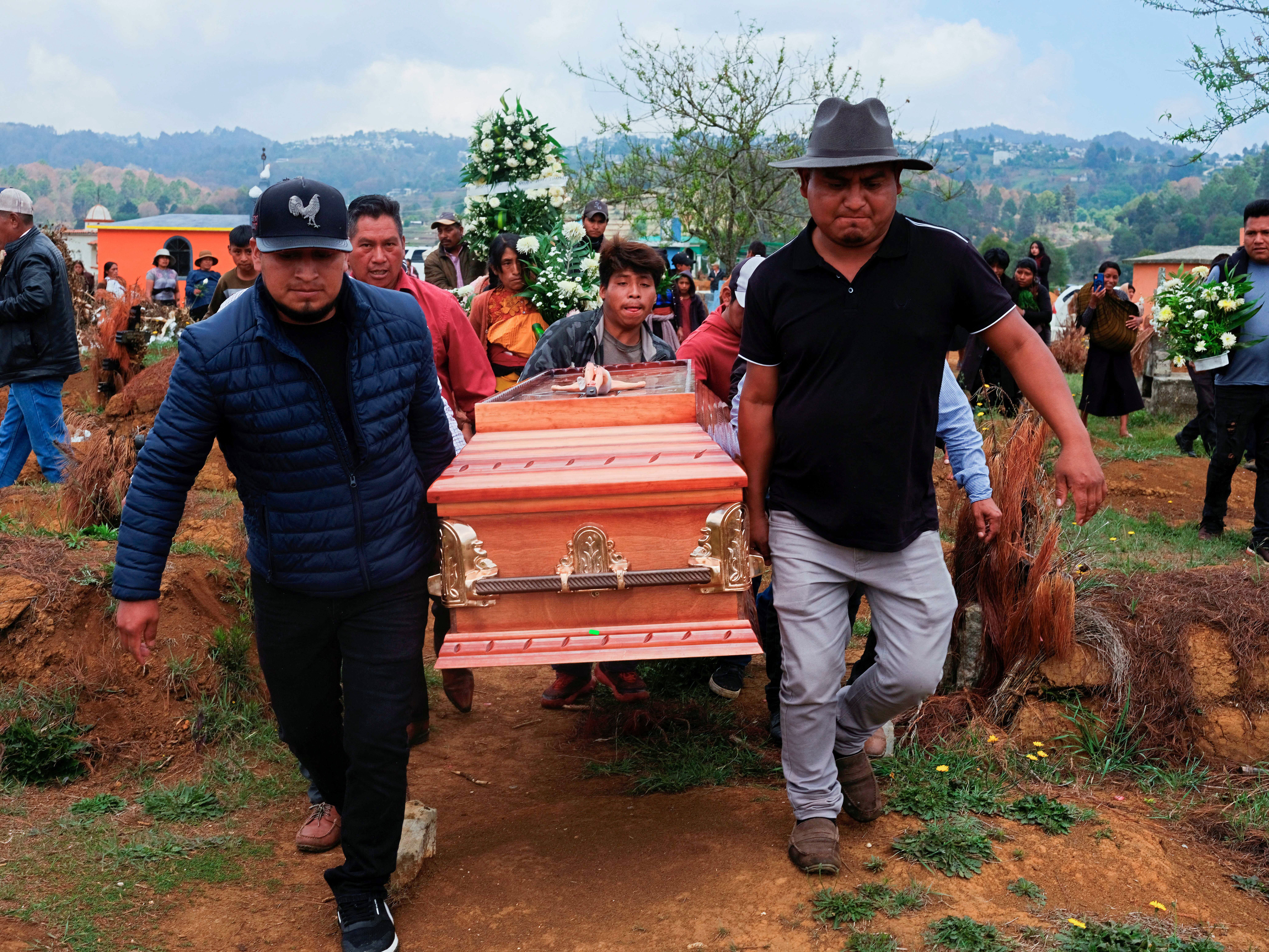Pallbearers transportation nan coffin of Royer Perez Jimenez, a 19-year-old Mexican migrant who was recovered dormant of a presumed termination successful an Immigration and Customs Enforcement detention halfway successful Florida connected March 16, 2026