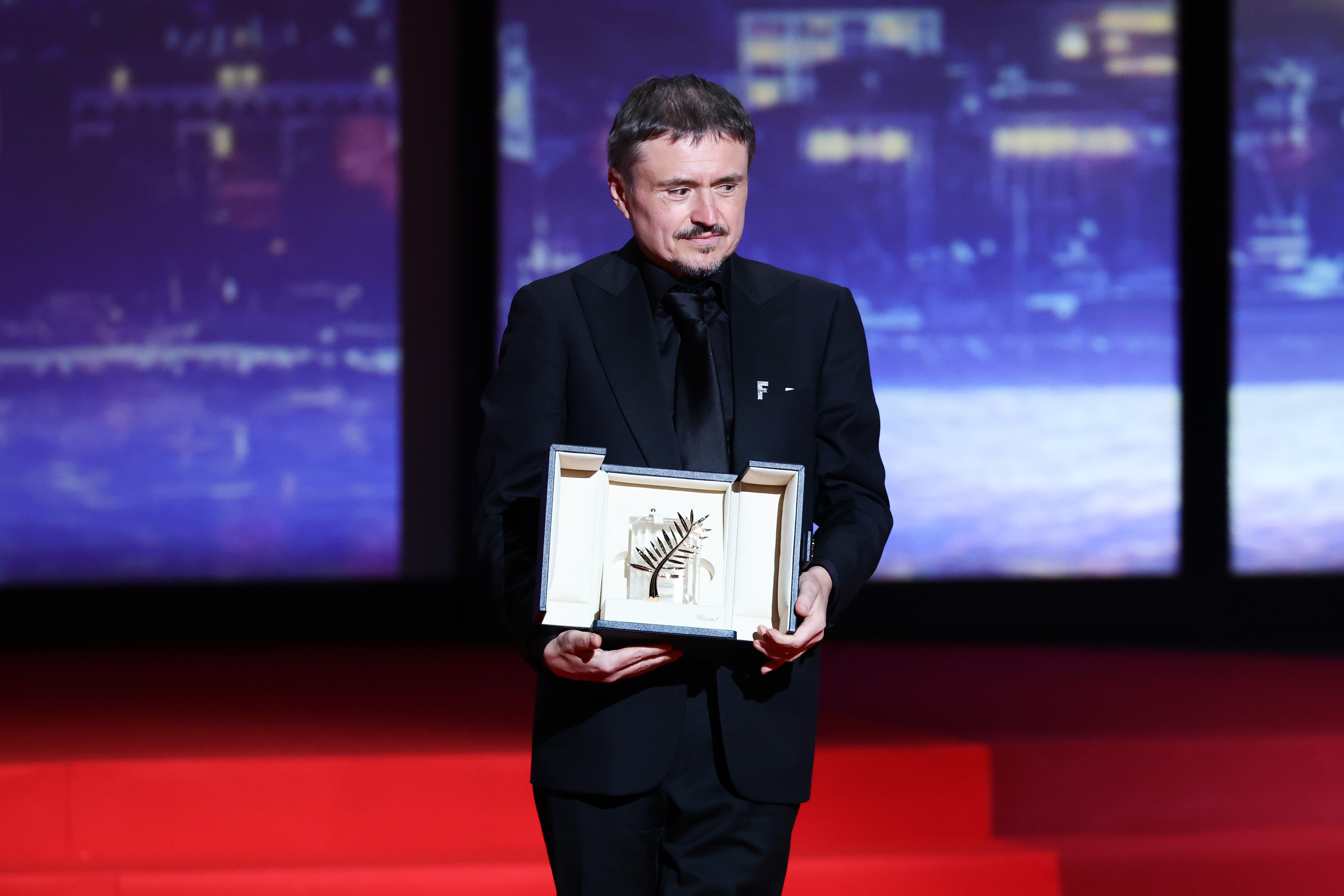 Cristian Mungiu accepts the Palme d’Or on stage during the closing ceremony of the 79th annual Cannes Film Festival at Palais des Festivals on May 23, 2026 in Cannes, France