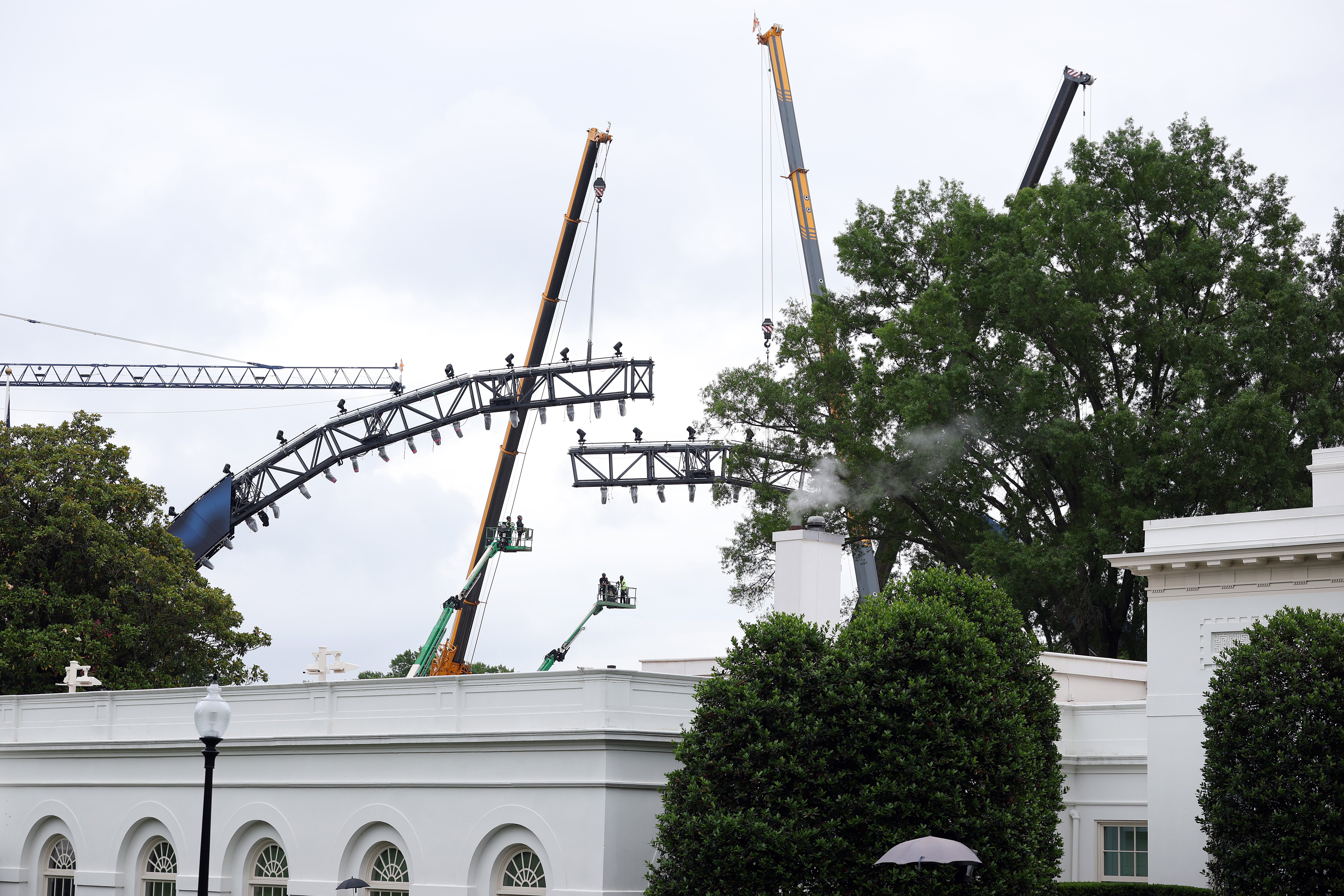 <p>Another photo taken Monday appears to show two sections of the rig being connected, using the cranes</p>