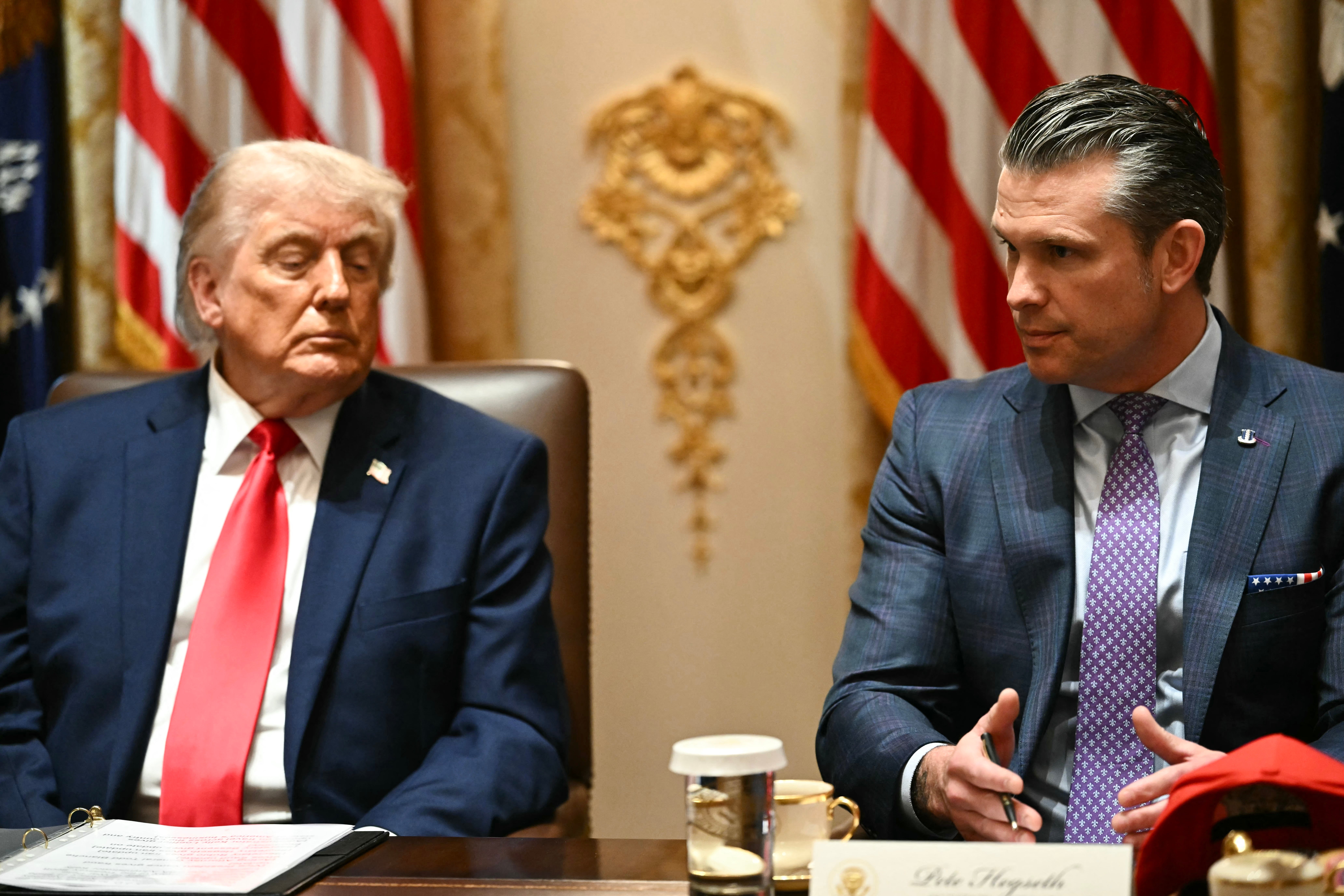 Donald Trump is reportedly astatine likelihood pinch his defence caput Pete Hegseth (R) complete nan memorandum of understanding