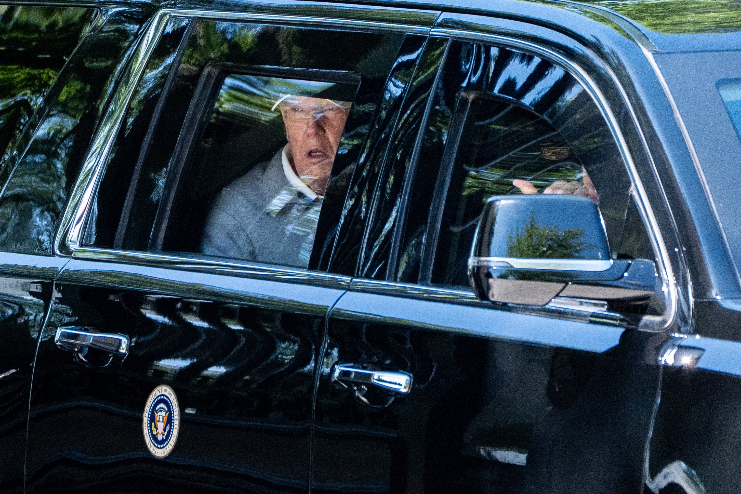 President Donald Trump looks retired nan model of his limousine astatine nan building successful Lafayette Park arsenic he departs nan White House connected Saturday — nan closest he came to a nationalist quality complete nan weekend