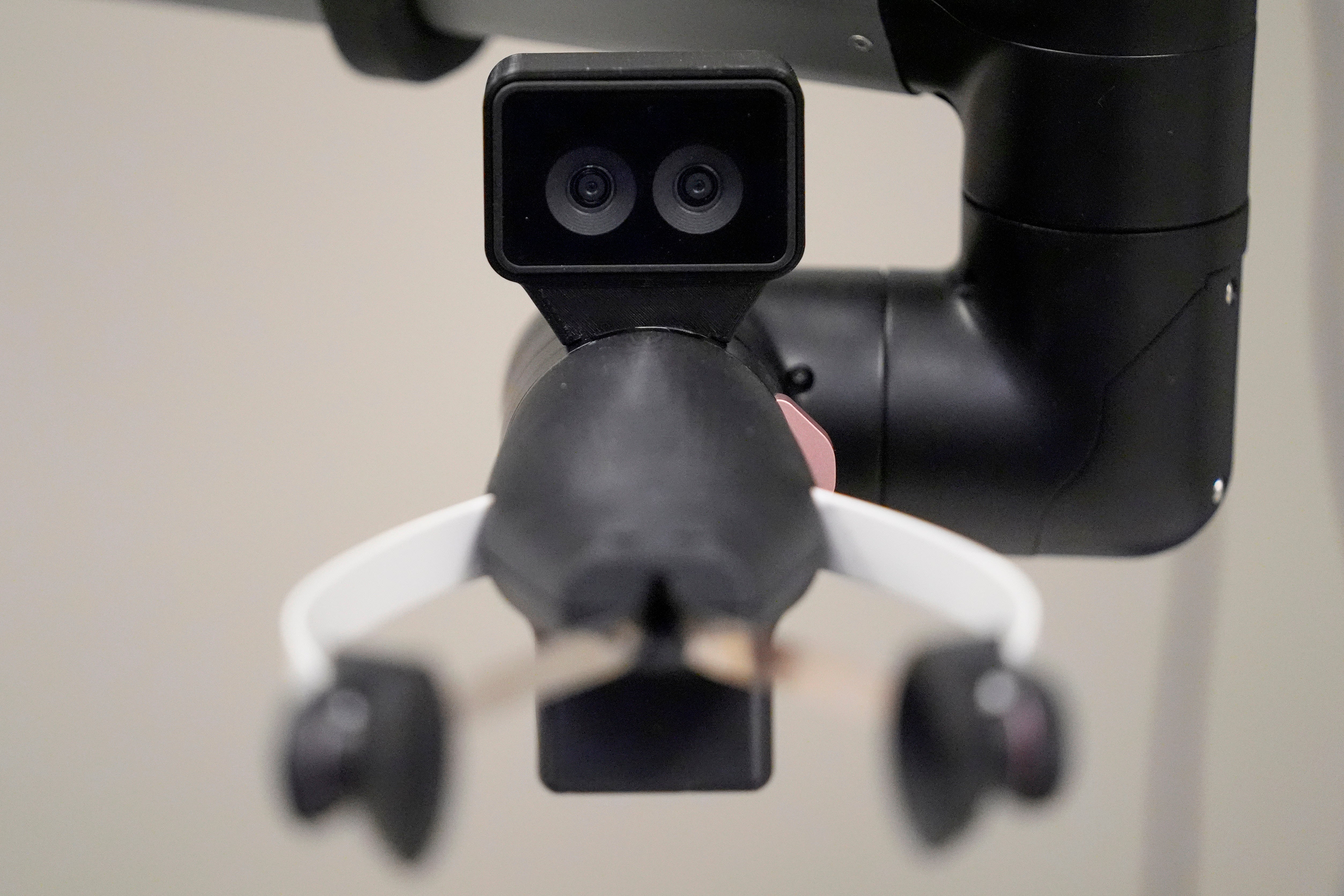 A camera connected nan manus of a Hello Robot uses 2 lenses for improved extent perception, during a demonstration