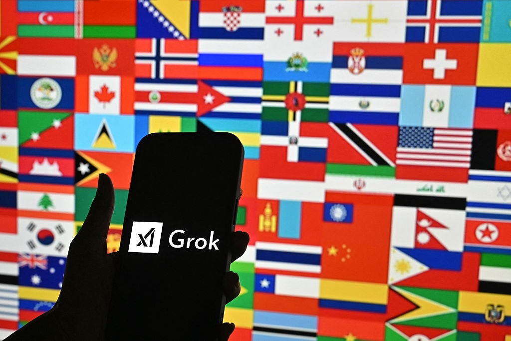 A person holds a smartphone bearing the logo of Grok, a generative AI chatbot developed by artificial intelligence company xAI, in Bengaluru on 15 January, 2026