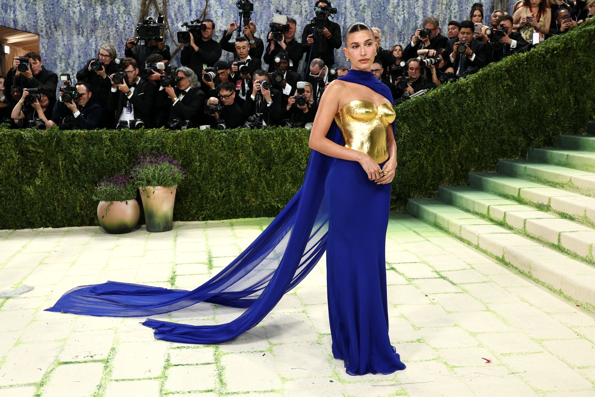 Hailey Bieber wore a gold and cobalt blue custom Saint Laurent gown at this year’s Met Gala